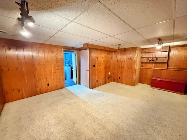 a big room with closet and windows
