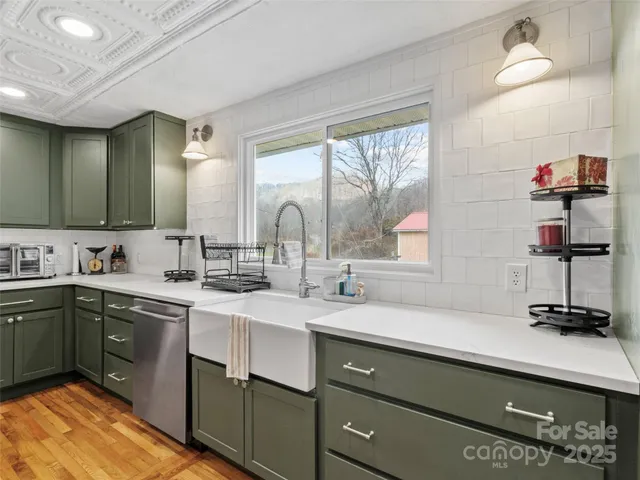 a kitchen with a stove oven and sink
