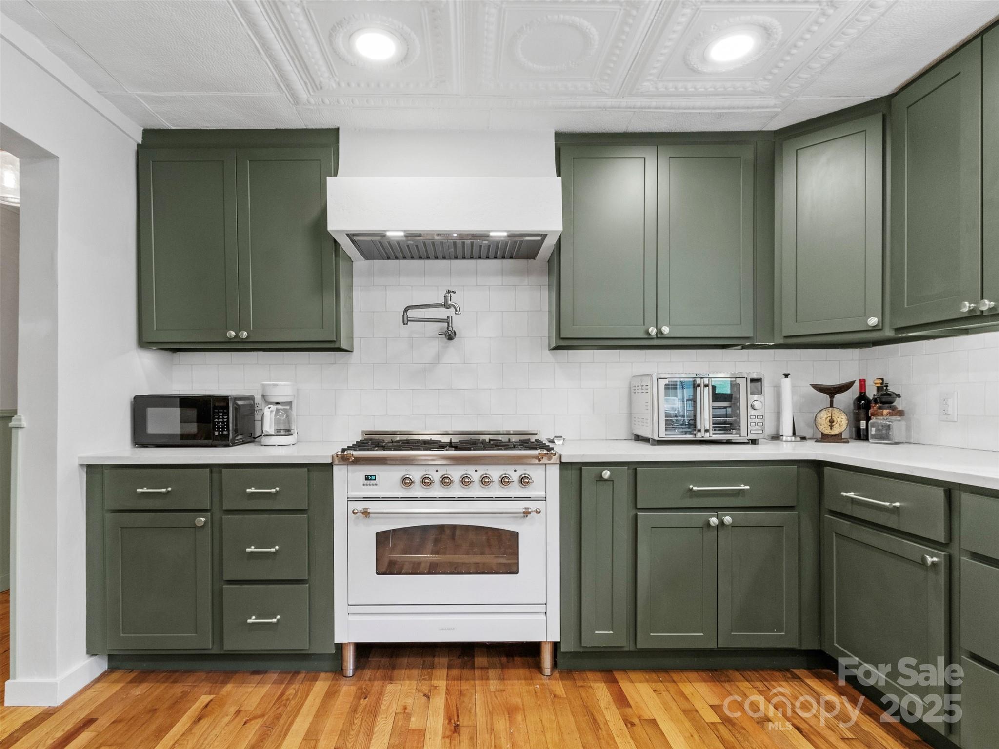 456 Windy Gap Road Mars Hill, NC 28754 - Photo 15 of 47 a kitchen with a stove oven and sink