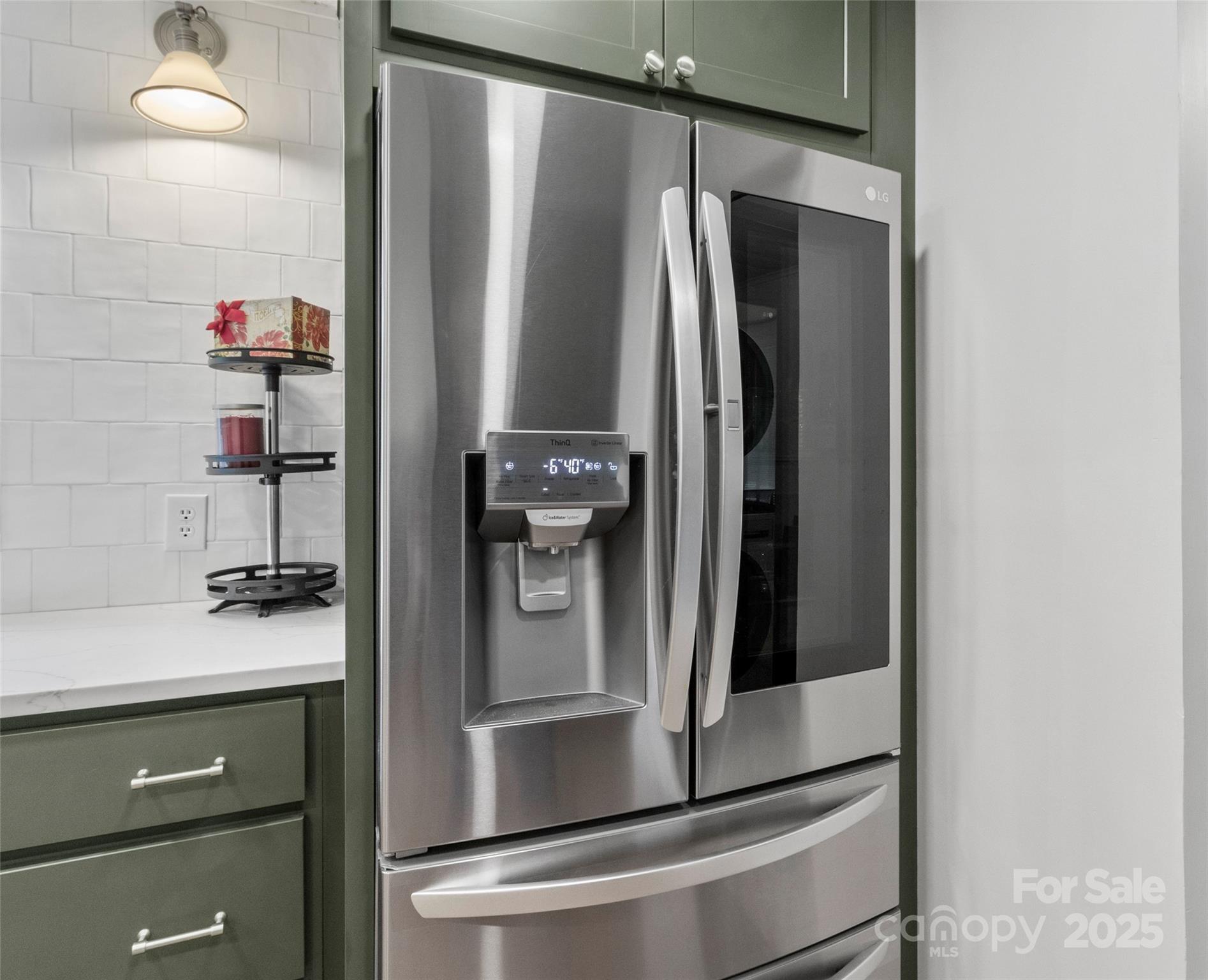 456 Windy Gap Road Mars Hill, NC 28754 - Photo 17 of 47 a close view of water heater and cabinet