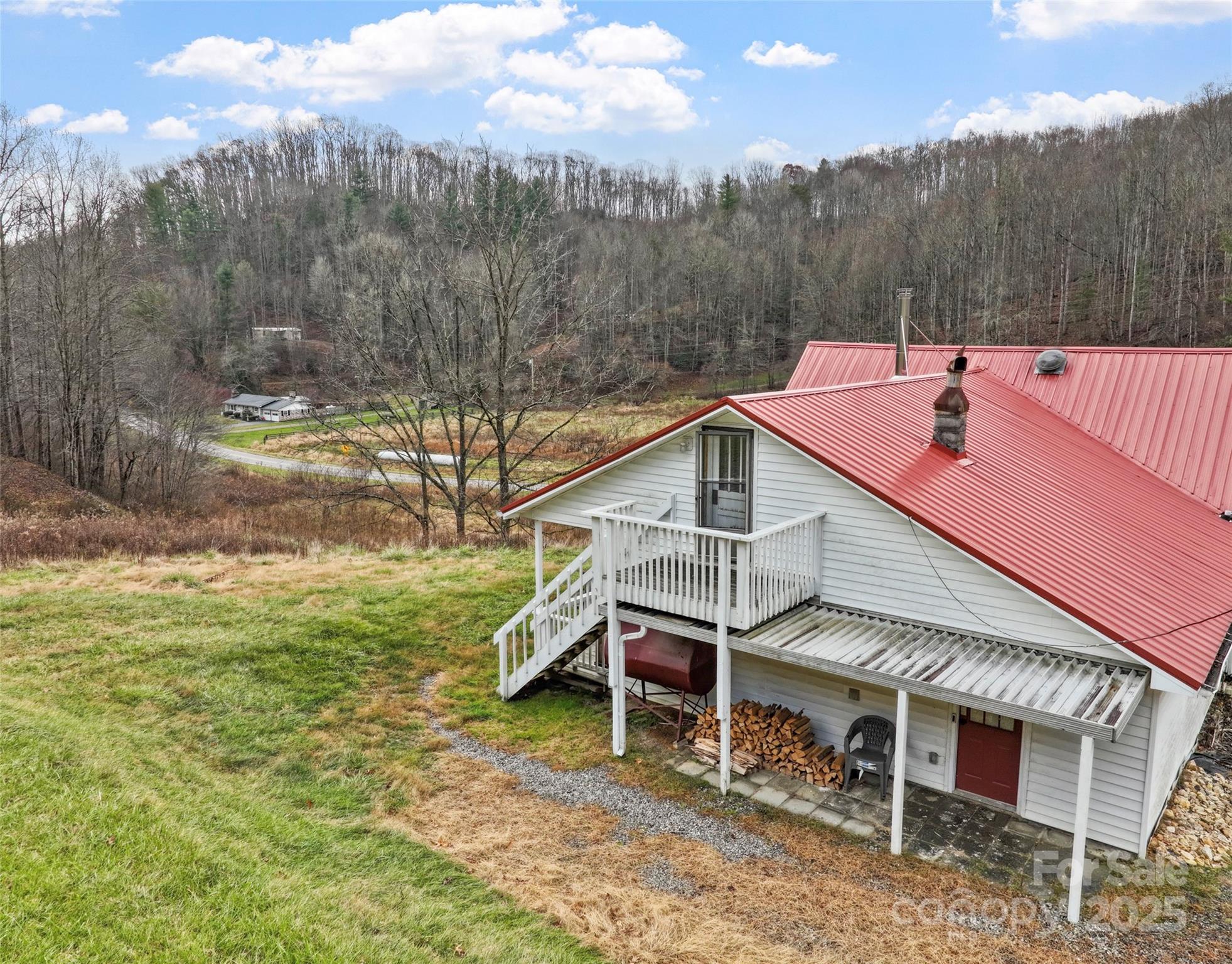 456 Windy Gap Road Mars Hill, NC 28754 - Photo 40 of 47 a view of a house with a yard