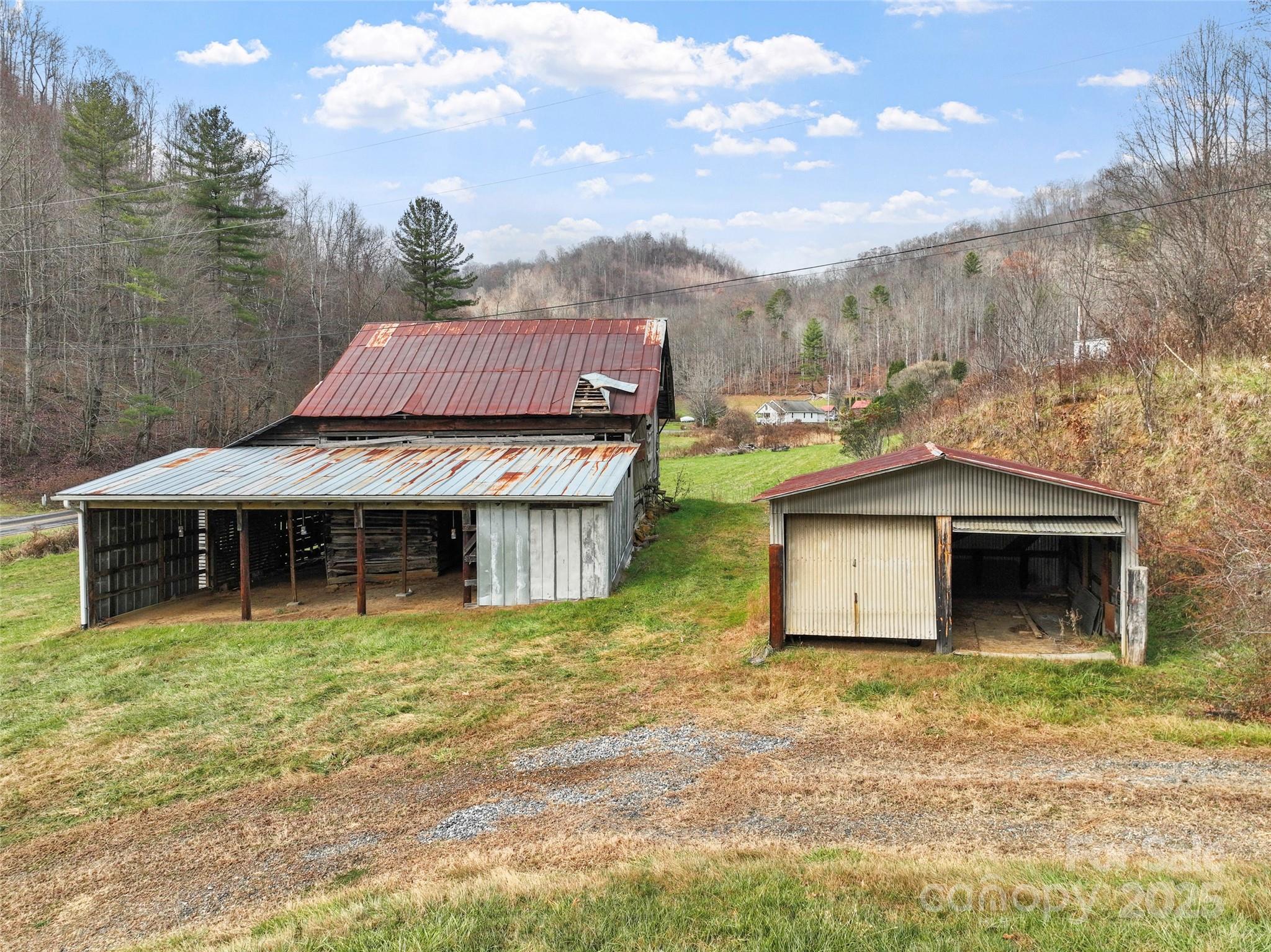 456 Windy Gap Road Mars Hill, NC 28754 - Photo 42 of 47 a front view of a house with garden