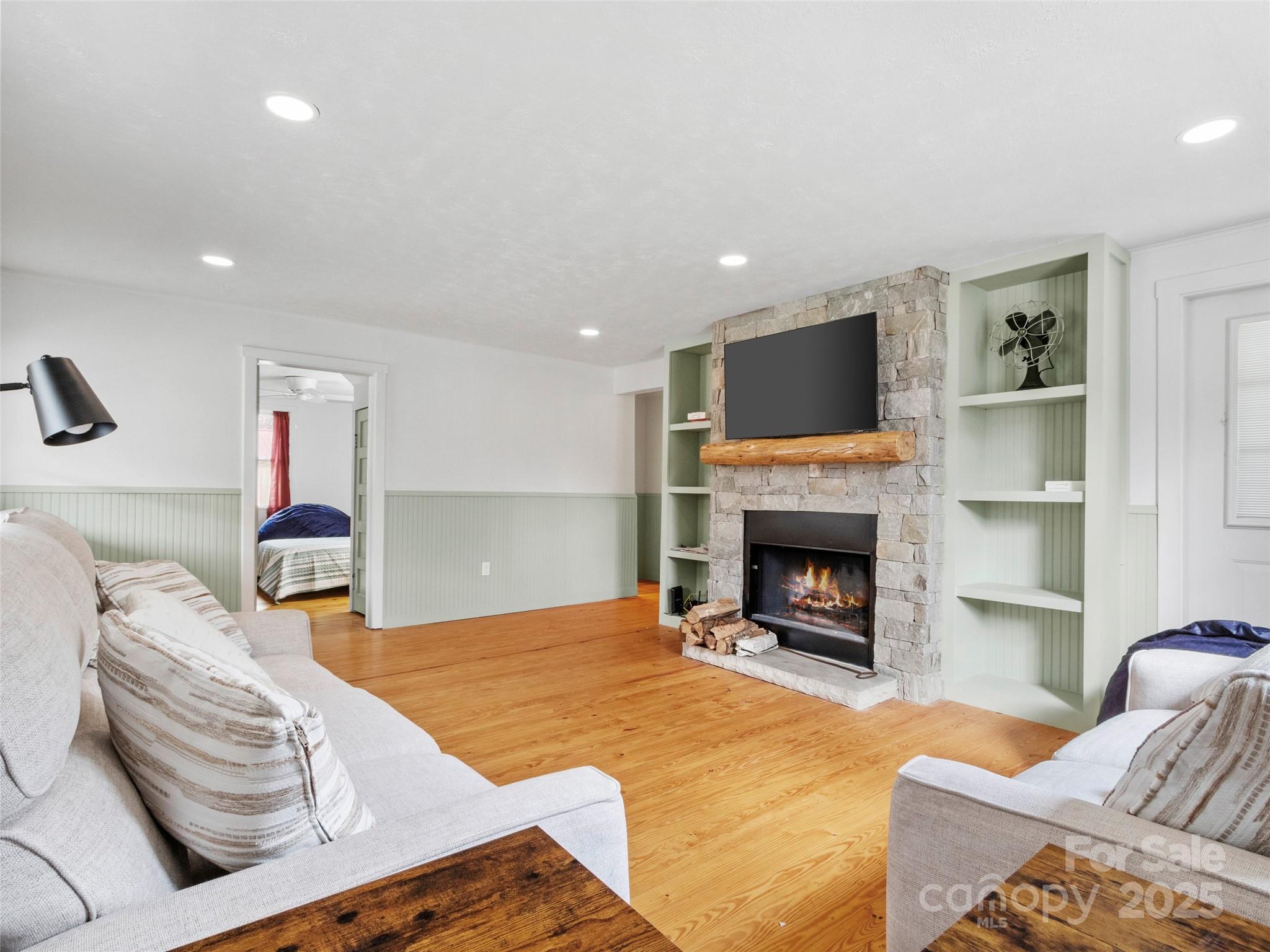 456 Windy Gap Road Mars Hill, NC 28754 - Photo 10 of 47 a living room with furniture and a fireplace