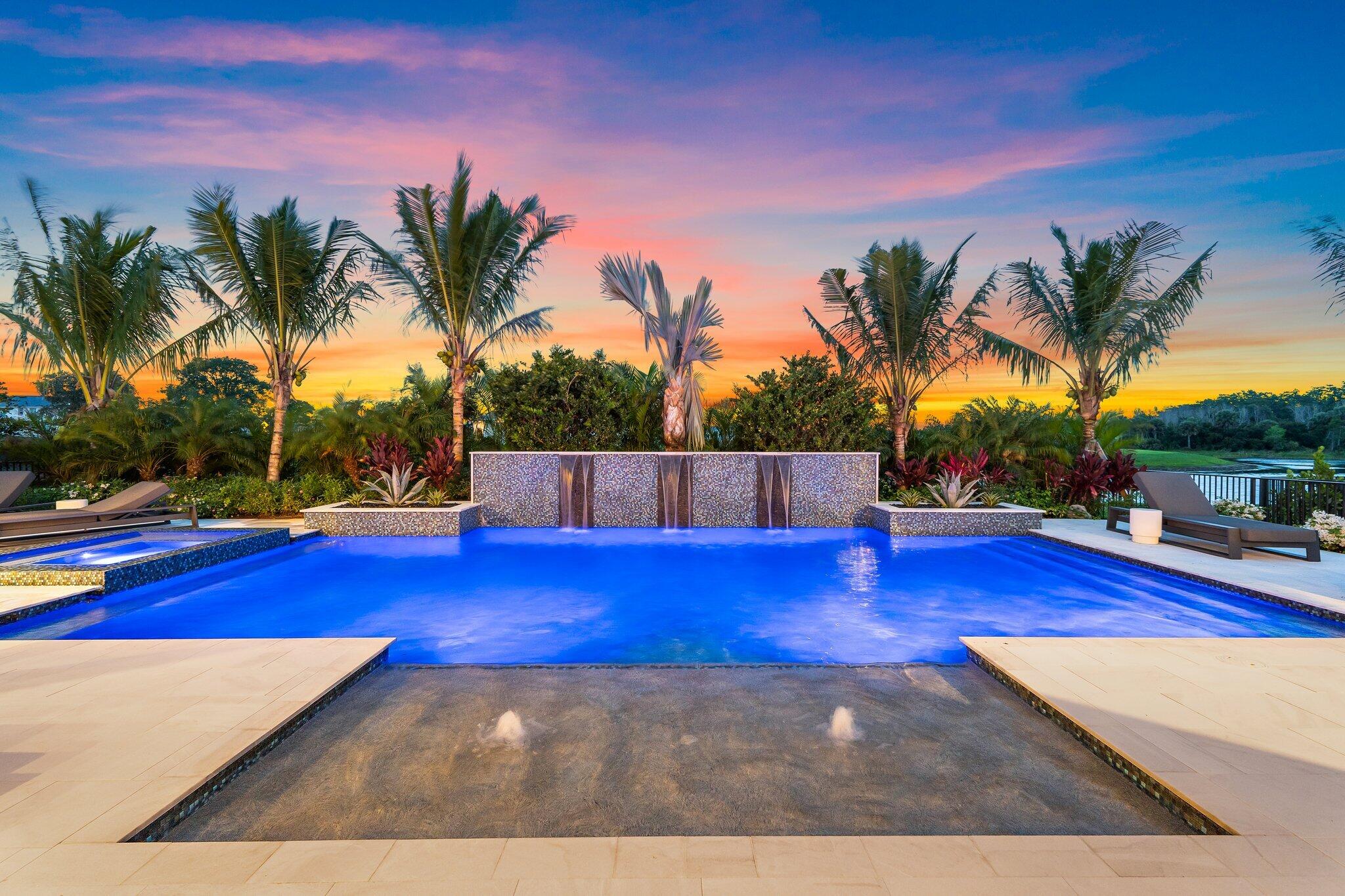 20049 Southeast Bridgewater Drive Jupiter, FL 33458 - Photo 14 of 77 a view of a swimming pool with palm trees