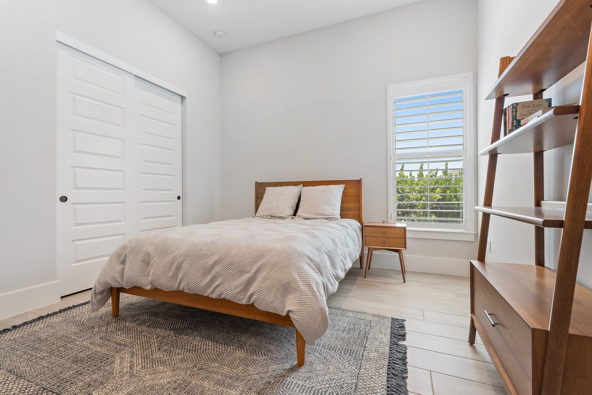 20049 Southeast Bridgewater Drive Jupiter, FL 33458 - Photo 16 of 77 a bedroom with a bed and a window