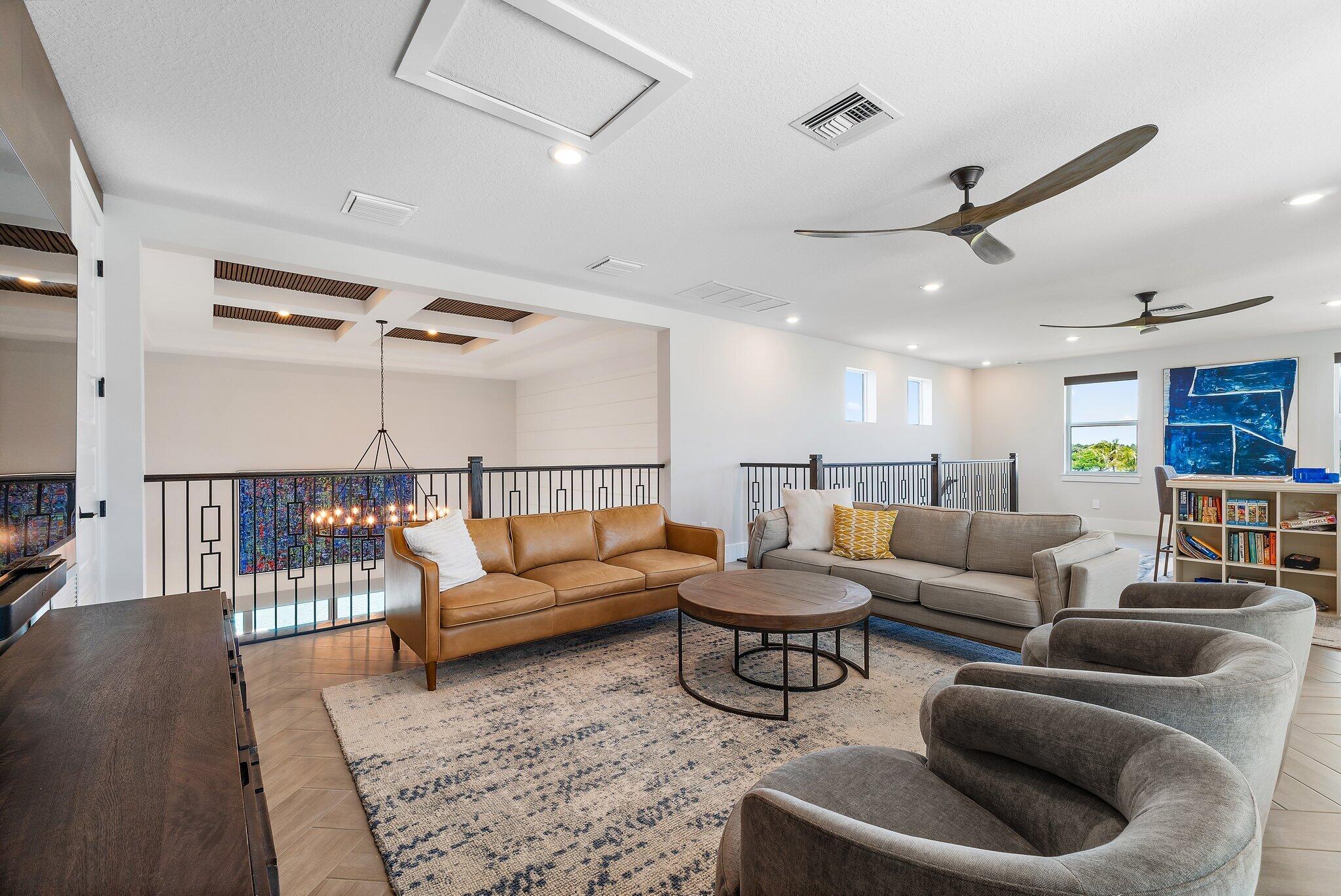 20049 Southeast Bridgewater Drive Jupiter, FL 33458 - Photo 25 of 77 a living room with furniture kitchen view and a wooden floor