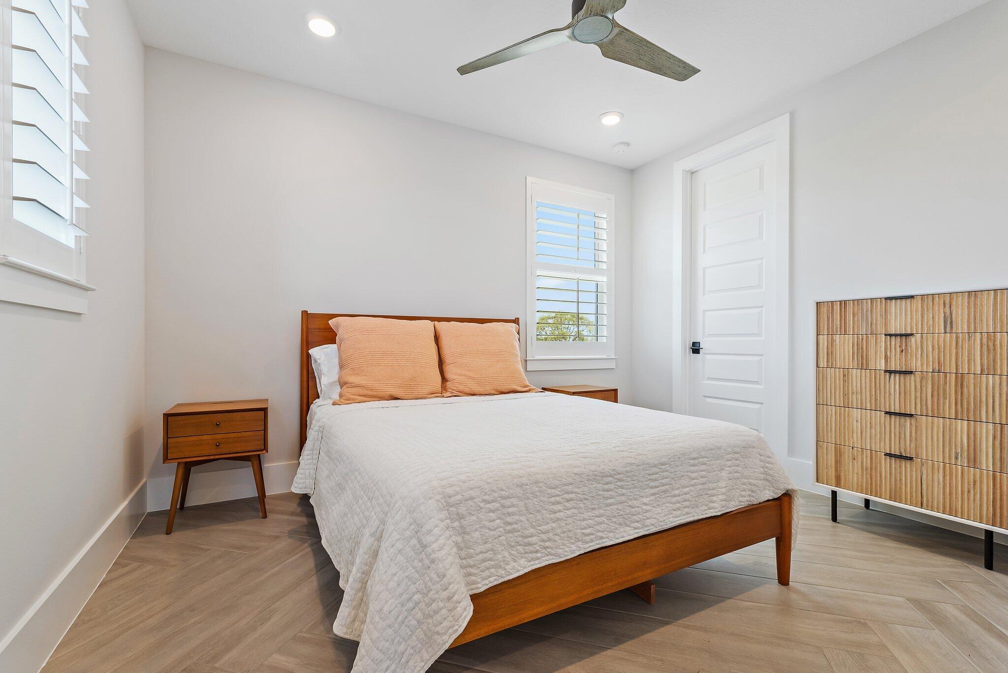 20049 Southeast Bridgewater Drive Jupiter, FL 33458 - Photo 27 of 77 a bedroom with a bed and a window