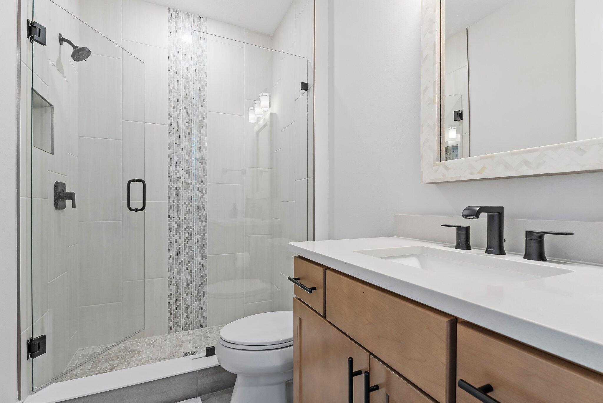 20049 Southeast Bridgewater Drive Jupiter, FL 33458 - Photo 28 of 77 a bathroom with a sink a toilet and shower