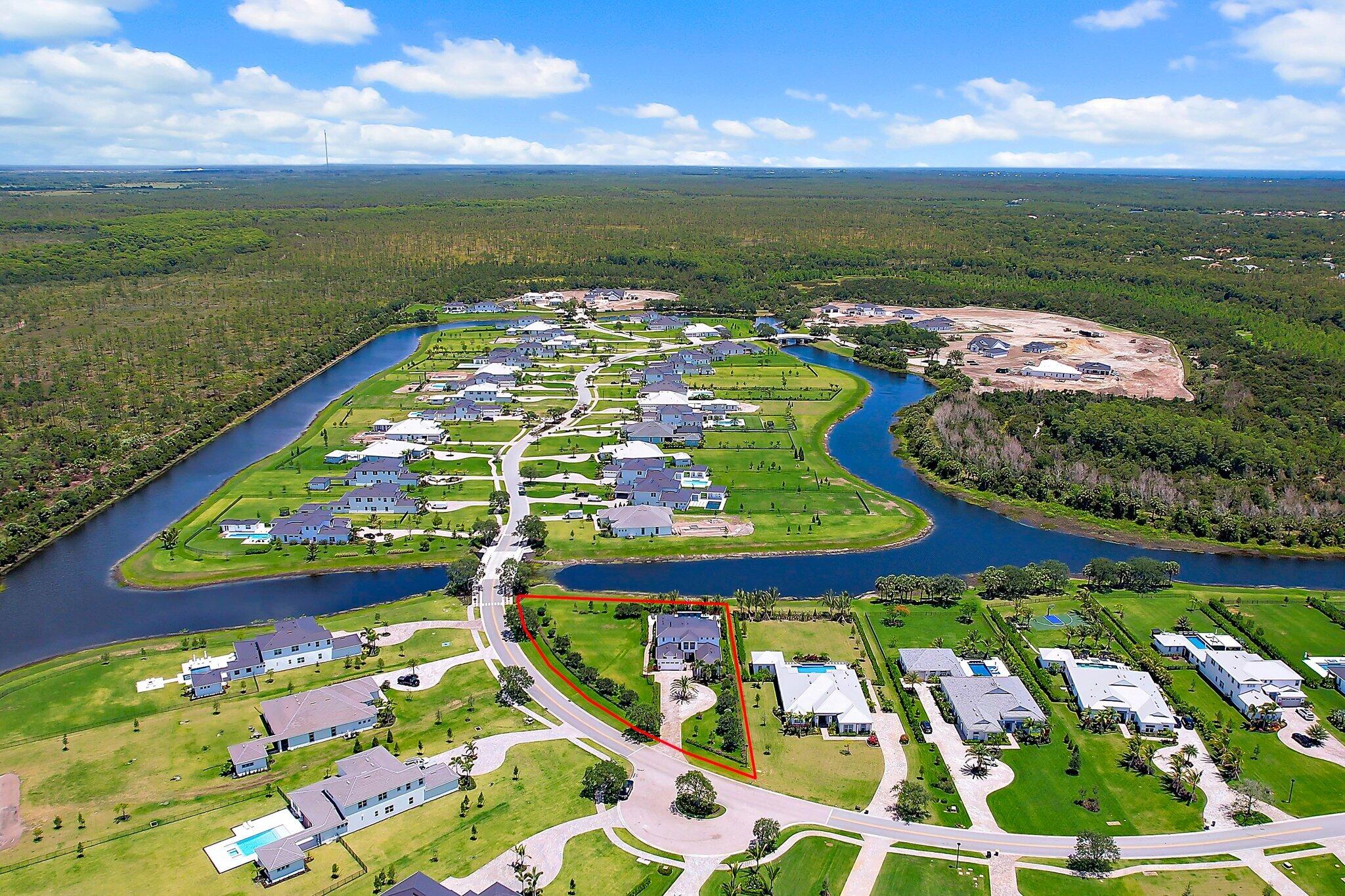 20049 Southeast Bridgewater Drive Jupiter, FL 33458 - Photo 3 of 77 Front Elevation wtih Side Yard