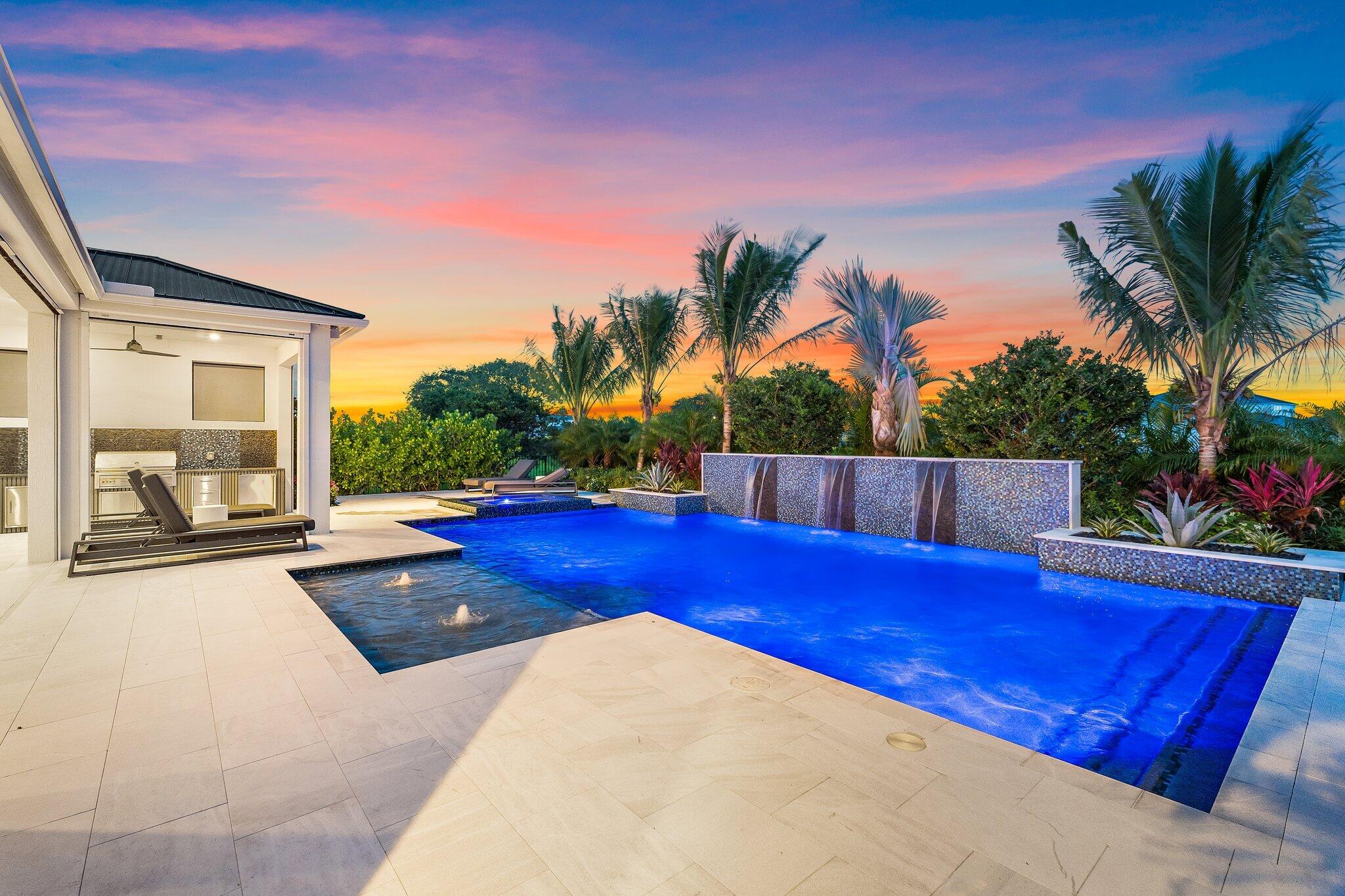 20049 Southeast Bridgewater Drive Jupiter, FL 33458 - Photo 40 of 77 a view of backyard with swimming pool and outdoor seating