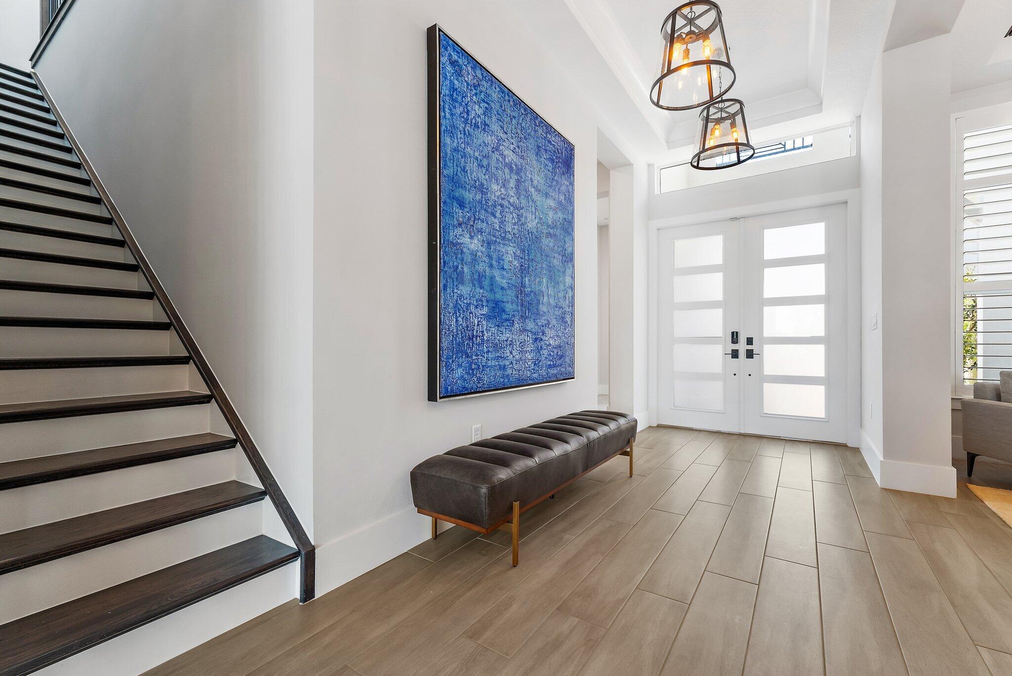 20049 Southeast Bridgewater Drive Jupiter, FL 33458 - Photo 48 of 77 a view of a hallway with wooden floor and staircase