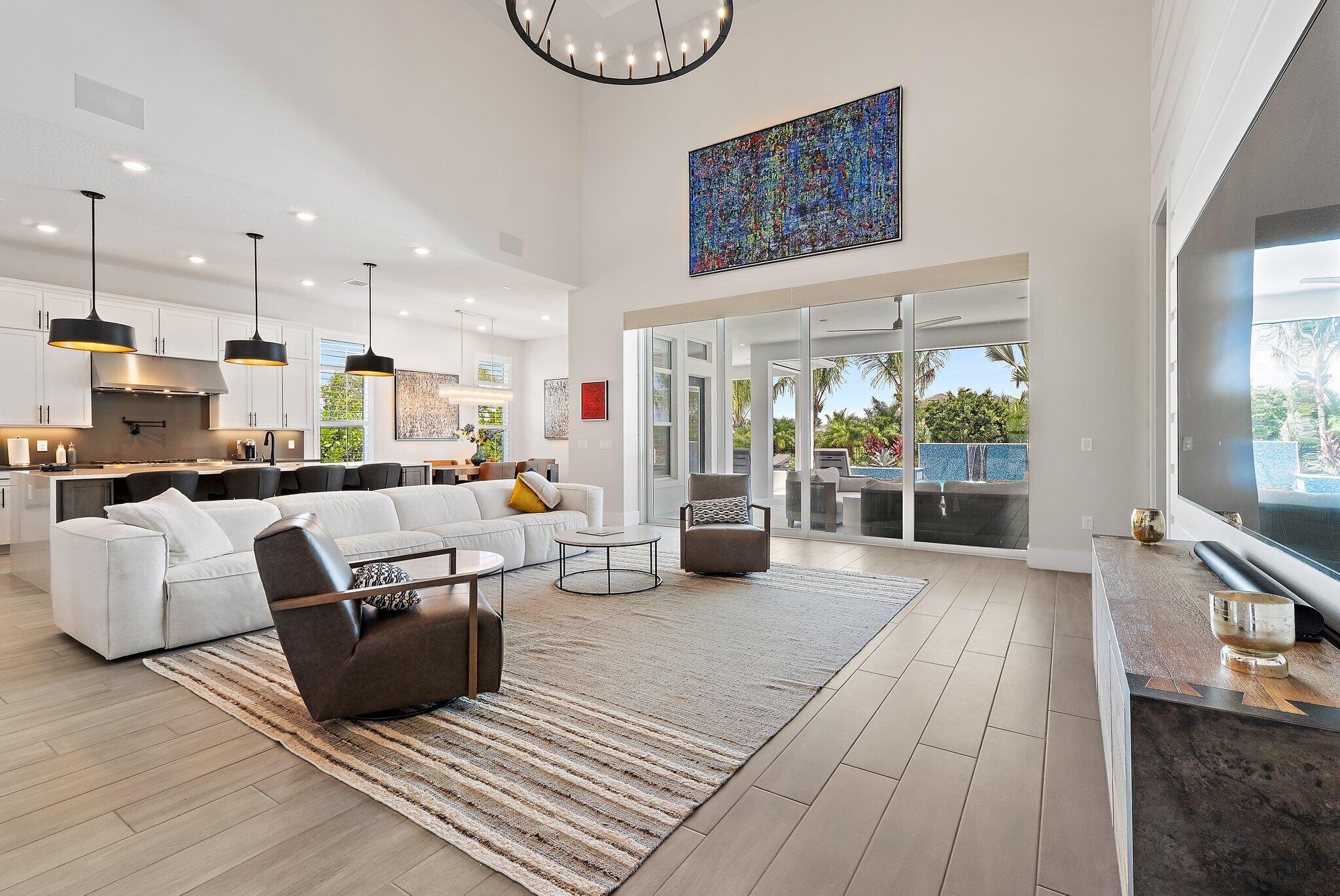 20049 Southeast Bridgewater Drive Jupiter, FL 33458 - Photo 5 of 77 a living room with furniture and a fireplace