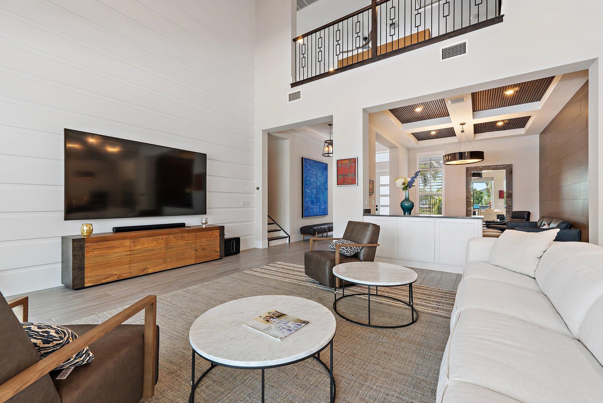 20049 Southeast Bridgewater Drive Jupiter, FL 33458 - Photo 53 of 77 a living room with furniture and a flat screen tv