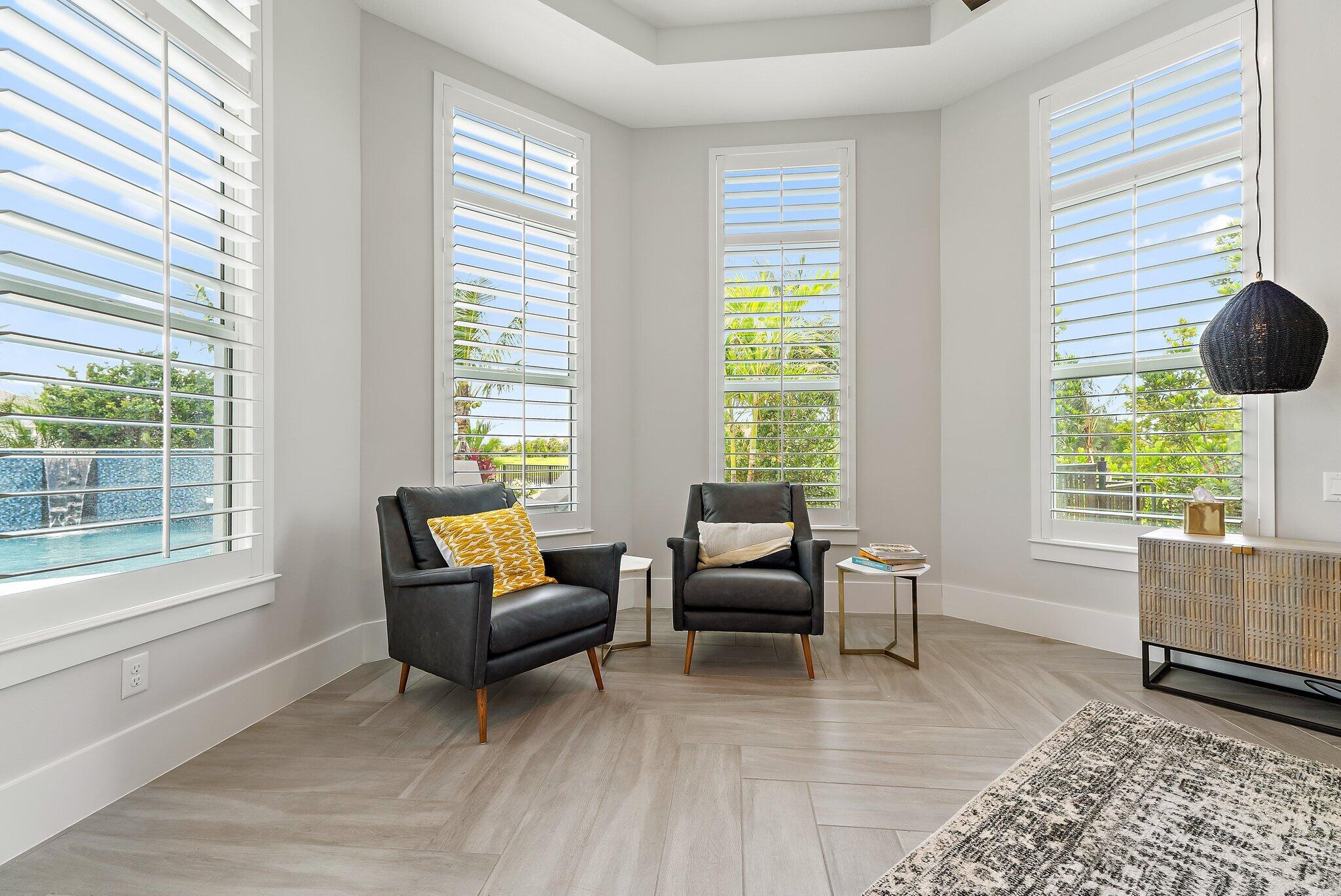 20049 Southeast Bridgewater Drive Jupiter, FL 33458 - Photo 62 of 77 a living room with furniture and a window