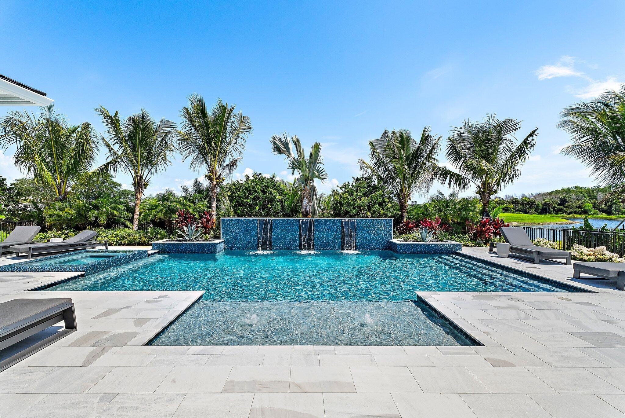 20049 Southeast Bridgewater Drive Jupiter, FL 33458 - Photo 73 of 77 a view of a backyard and swimming pool