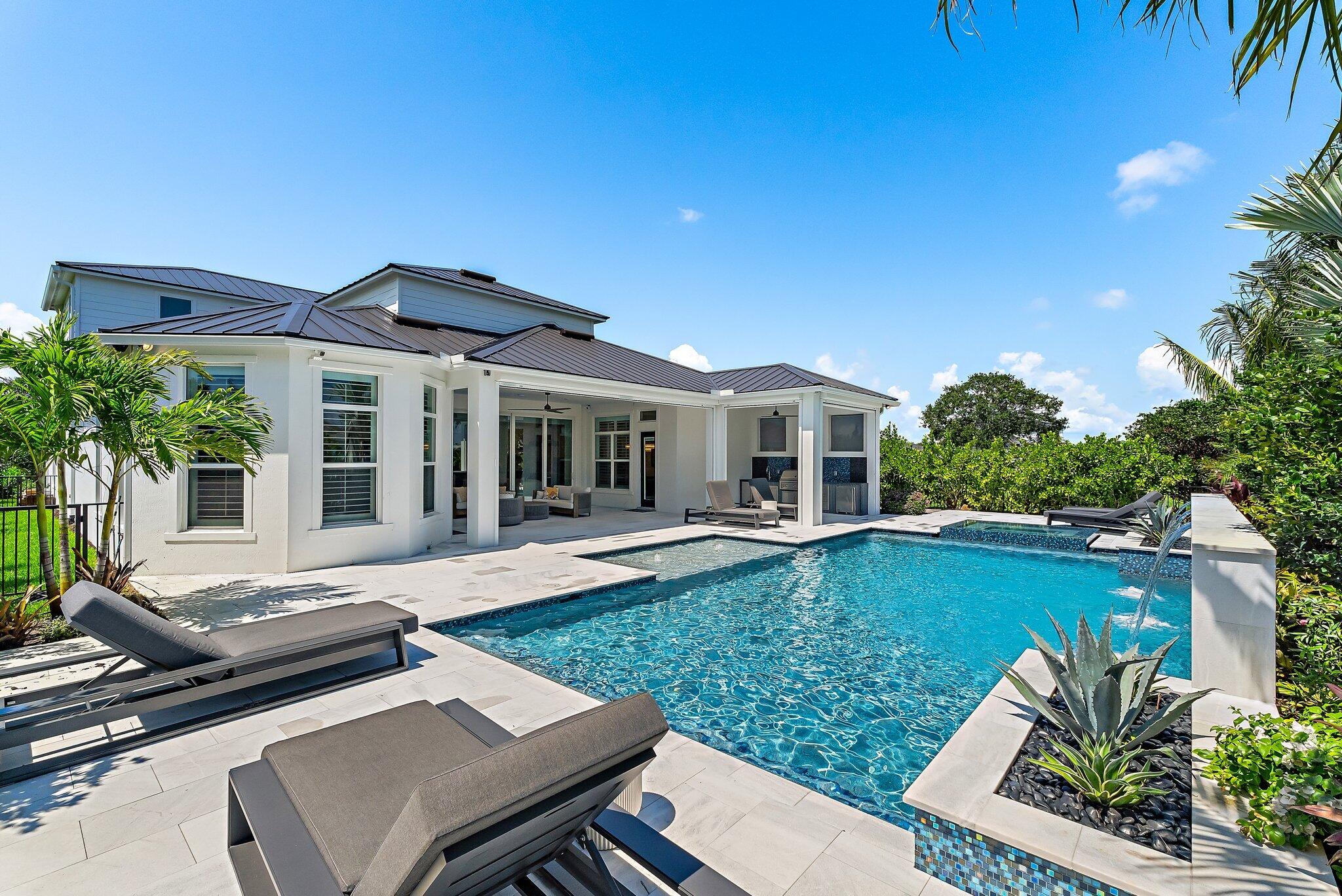 20049 Southeast Bridgewater Drive Jupiter, FL 33458 - Photo 75 of 77 a view of a house with swimming pool and sitting area