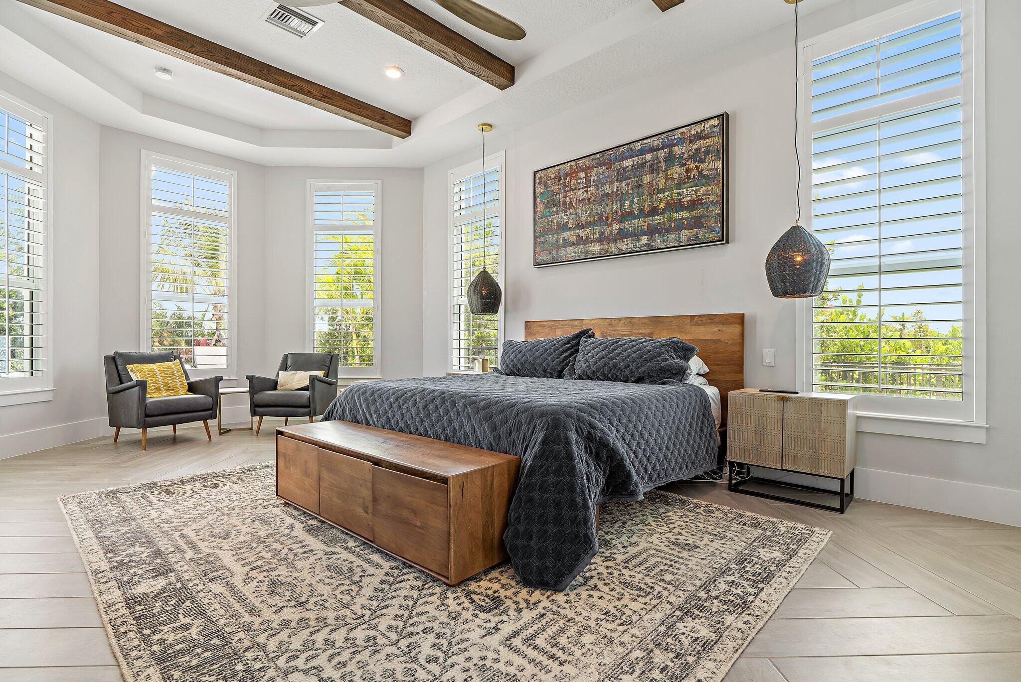 20049 Southeast Bridgewater Drive Jupiter, FL 33458 - Photo 9 of 77 a bedroom with a bed and a couch