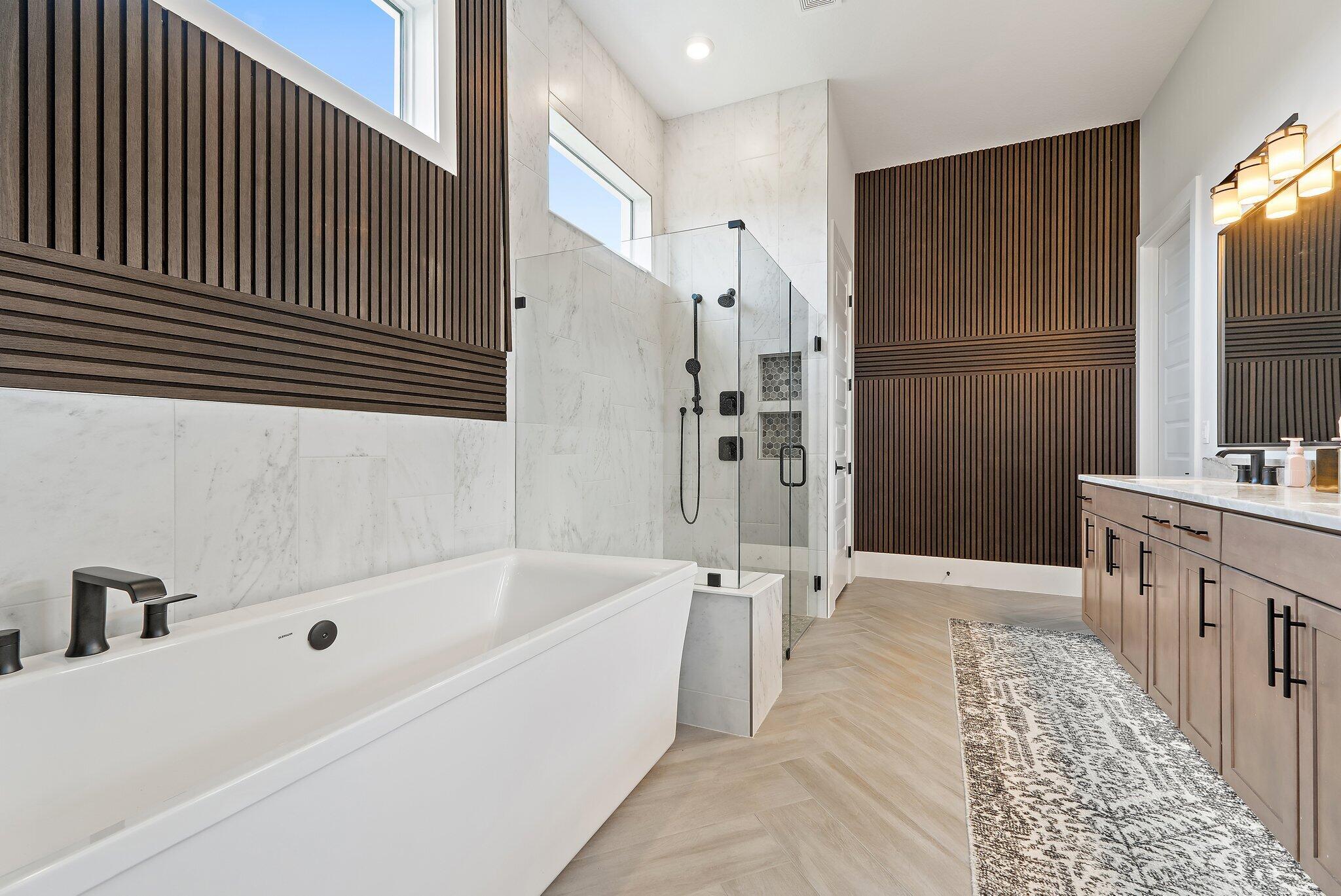20049 Southeast Bridgewater Drive Jupiter, FL 33458 - Photo 10 of 77 a bathroom with a bathtub and a sink