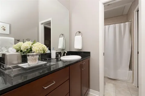 a bathroom with sink and mirror