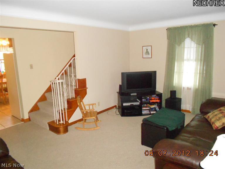 13820 Hathaway Road Cleveland, OH 44125 - Photo 10 of 23 WELCOME IN! EXPOSED STAIRCASE TO UPPER LEVEL
