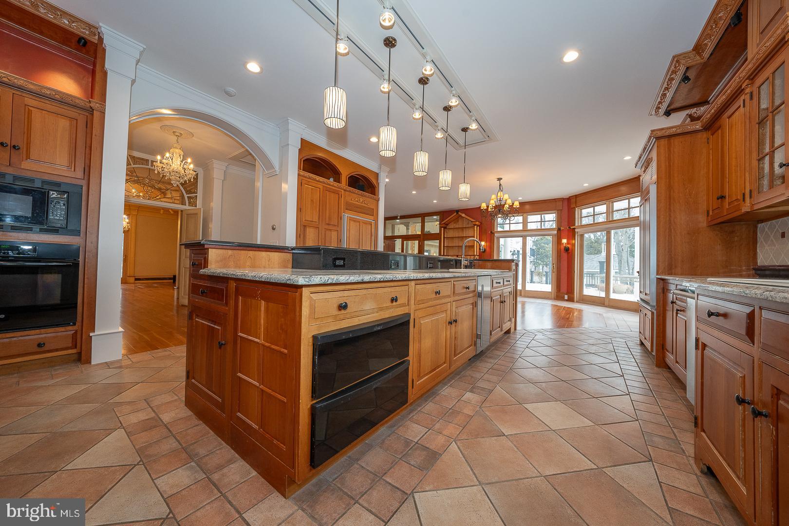 52 Mountain Laurel Lane Malvern, PA 19355 - Photo 12 of 58 a kitchen with stainless steel appliances granite countertop a stove and a refrigerator