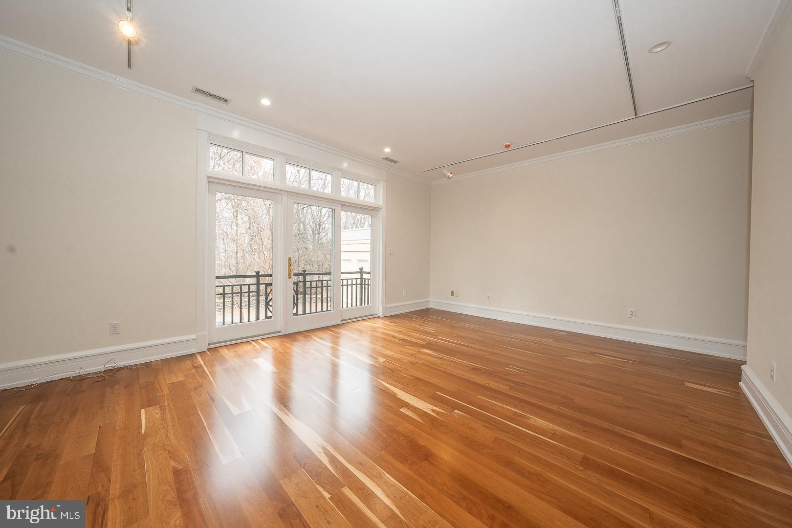 52 Mountain Laurel Lane Malvern, PA 19355 - Photo 28 of 58 a view of an empty room with wooden floor and a window