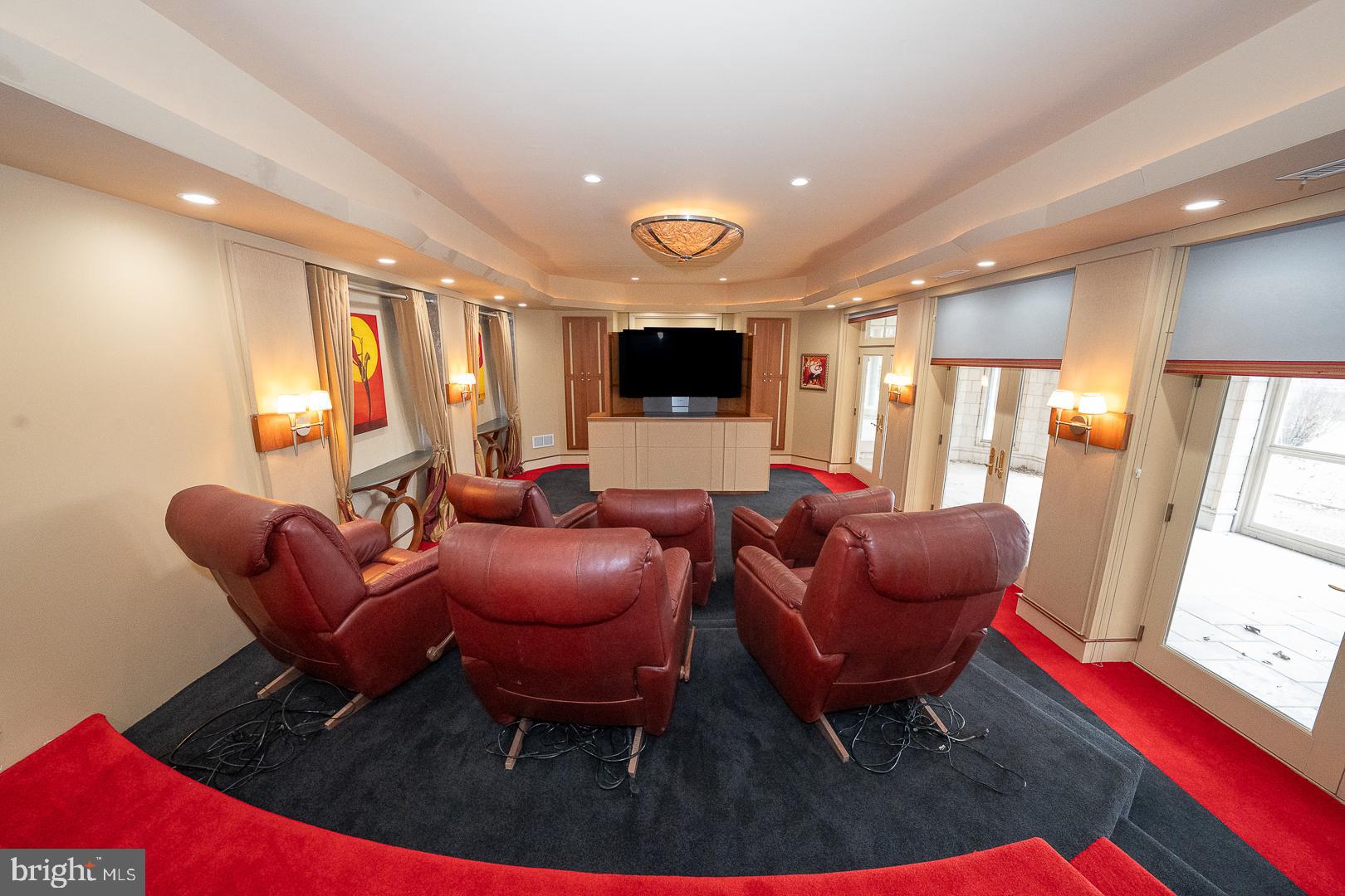 52 Mountain Laurel Lane Malvern, PA 19355 - Photo 37 of 58 a living room with furniture a flat screen tv and a large window