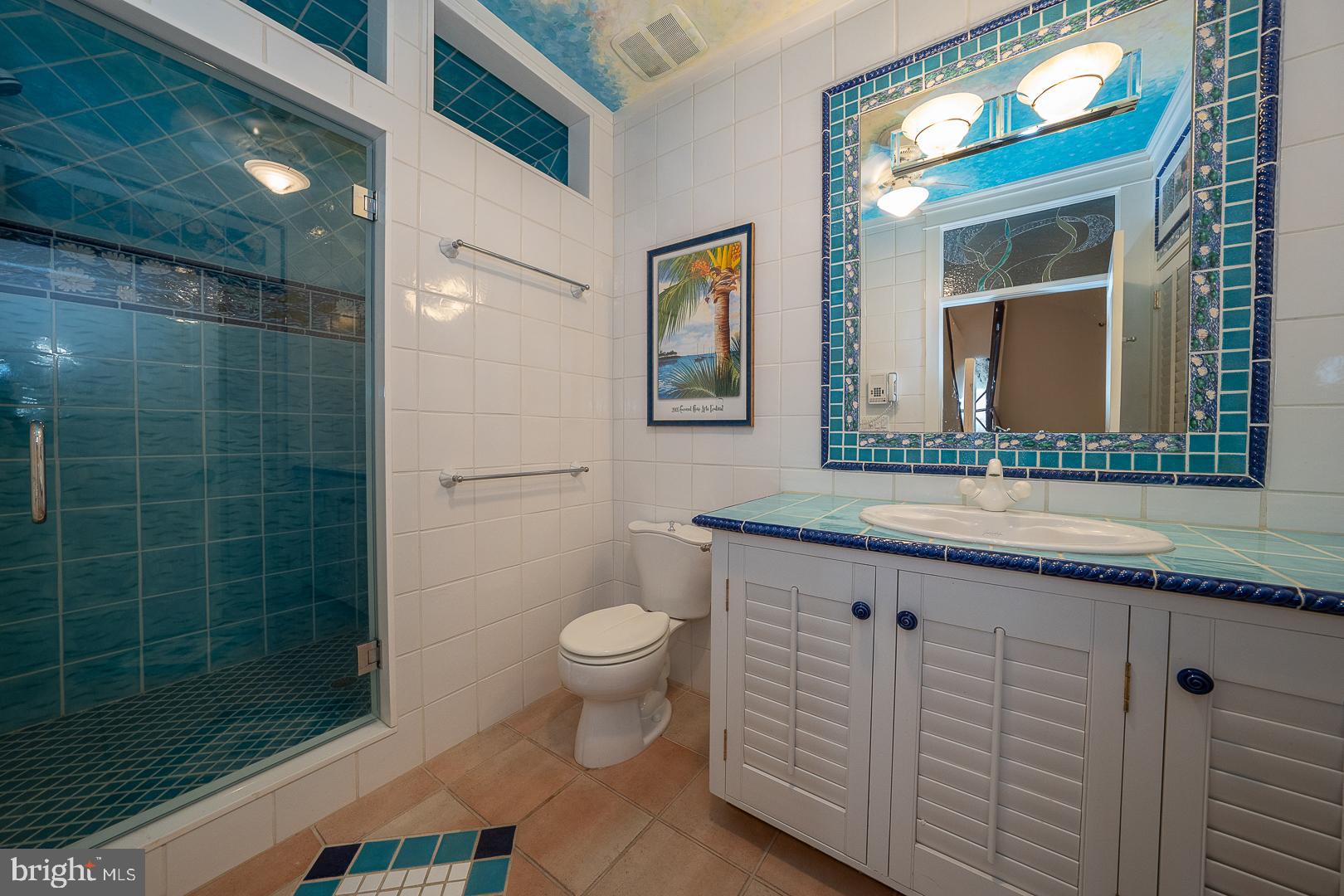 52 Mountain Laurel Lane Malvern, PA 19355 - Photo 41 of 58 a bathroom with a granite countertop sink mirror vanity and toilet