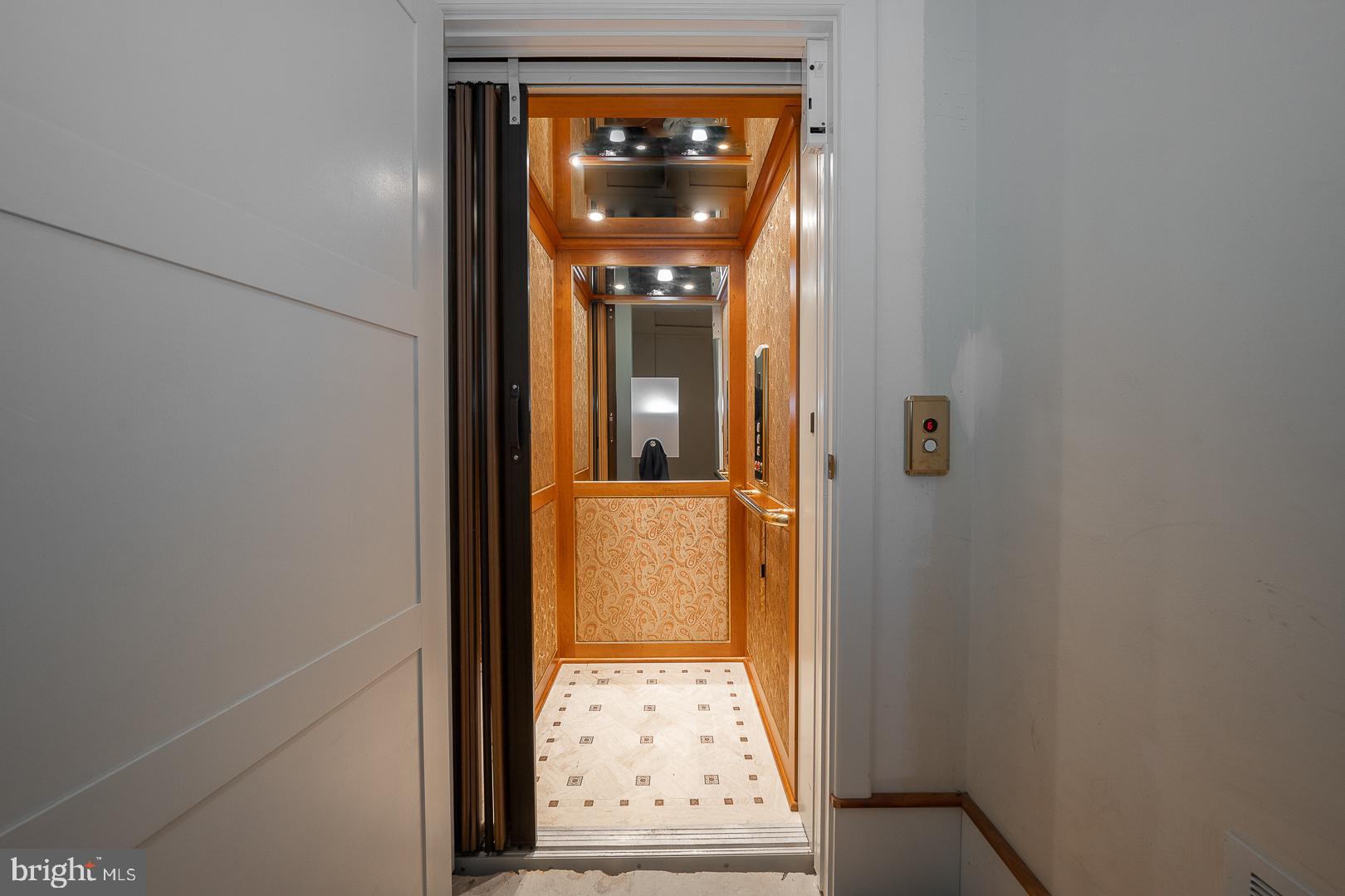 52 Mountain Laurel Lane Malvern, PA 19355 - Photo 42 of 58 a view of a hallway with wooden floor and a living room