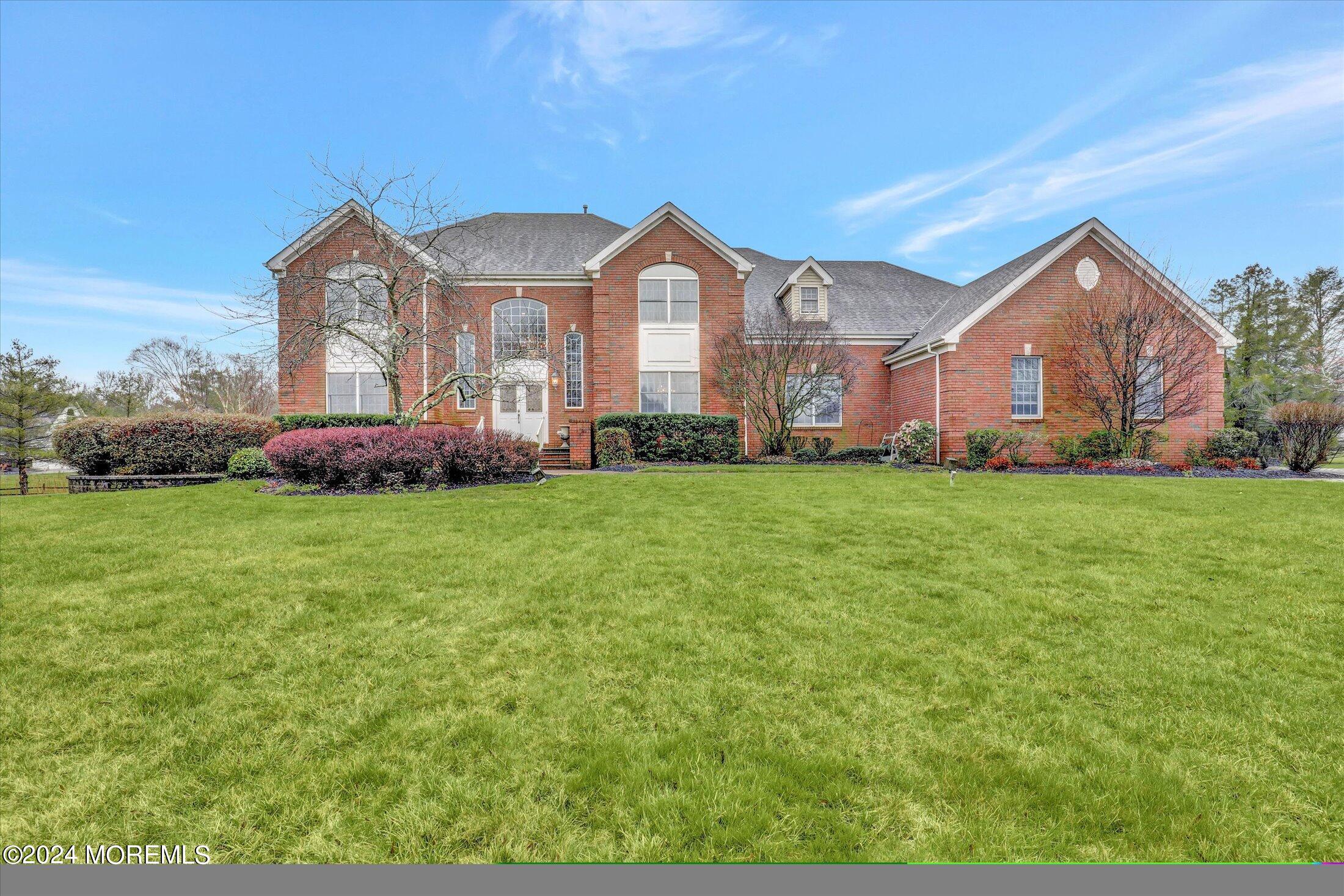 9 Shady Tree Lane Colts Neck, NJ 07722 - Photo 1 of 60 a view of a house with a big yard and large trees