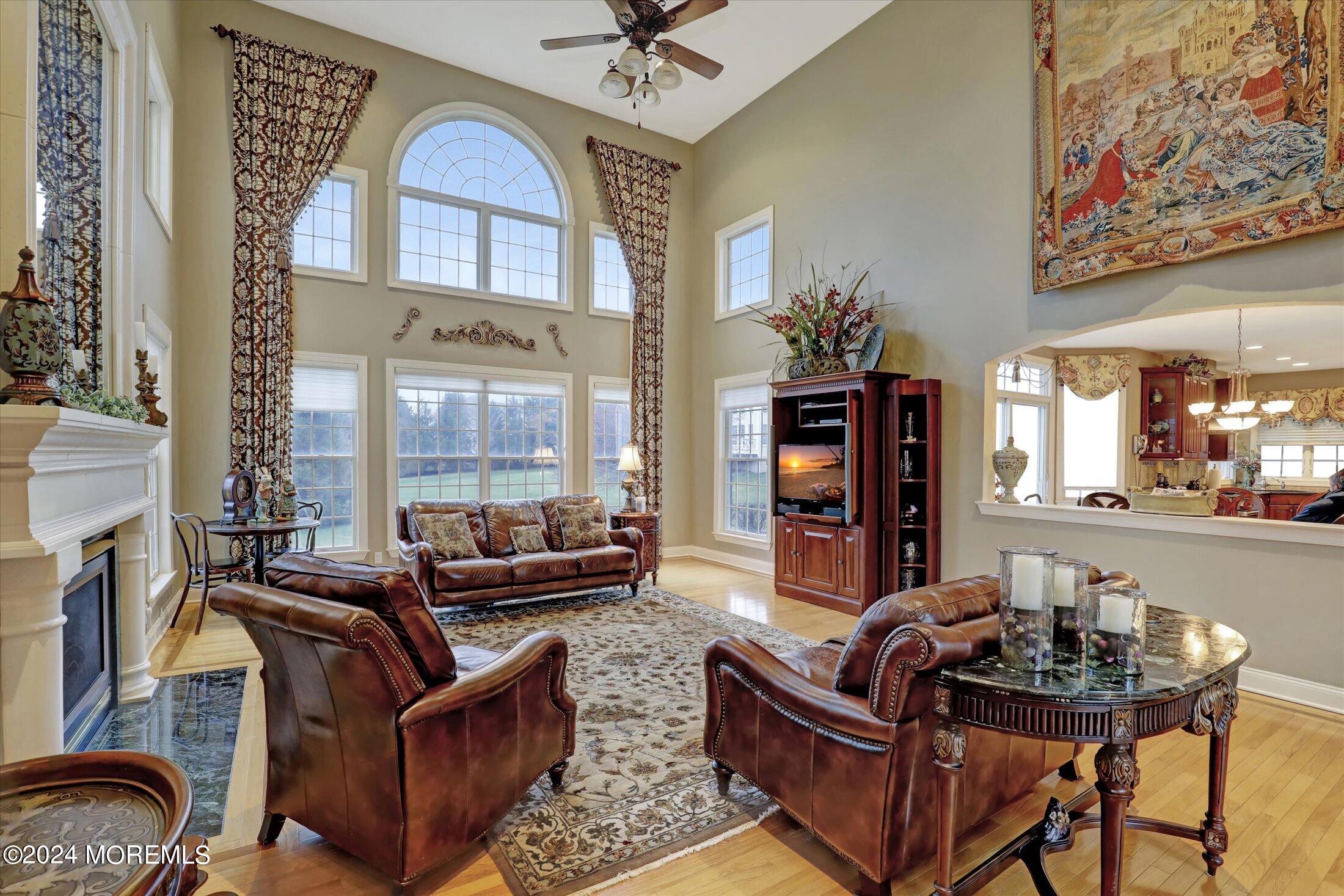 9 Shady Tree Lane Colts Neck, NJ 07722 - Photo 11 of 60 a living room with furniture and wooden floor