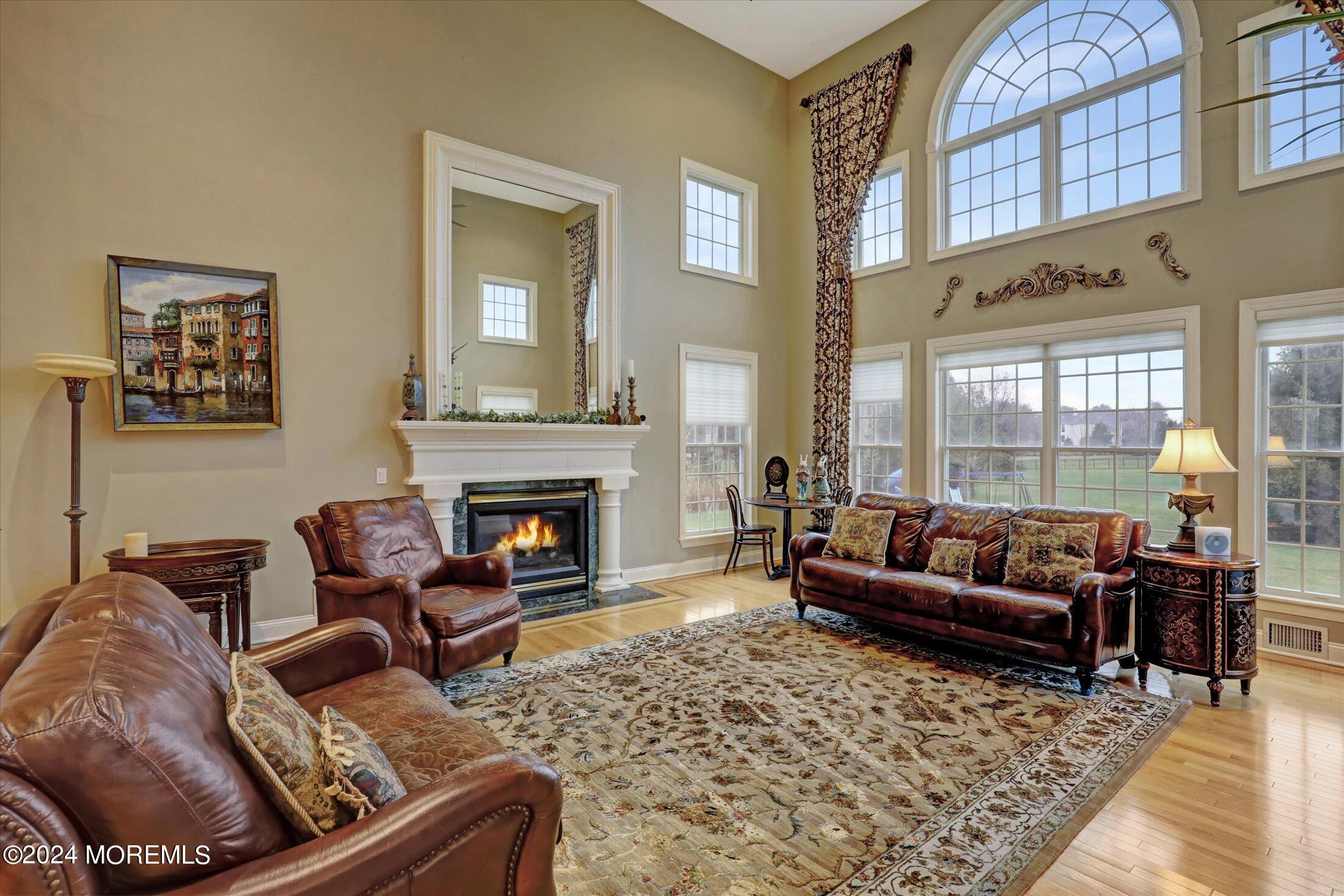 9 Shady Tree Lane Colts Neck, NJ 07722 - Photo 12 of 60 a living room with furniture and a fireplace