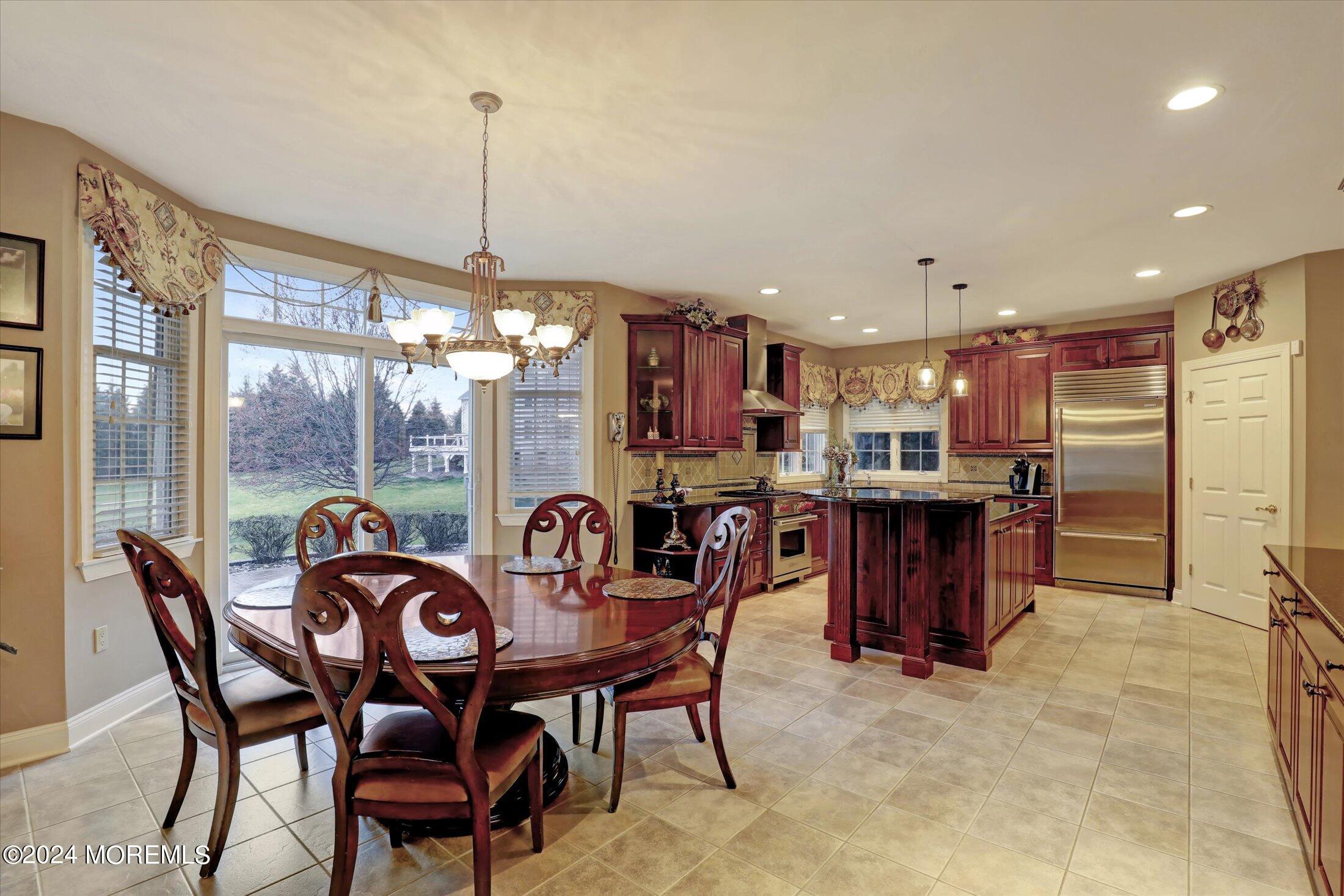 9 Shady Tree Lane Colts Neck, NJ 07722 - Photo 14 of 60 a dinning area with furniture and a chandelier