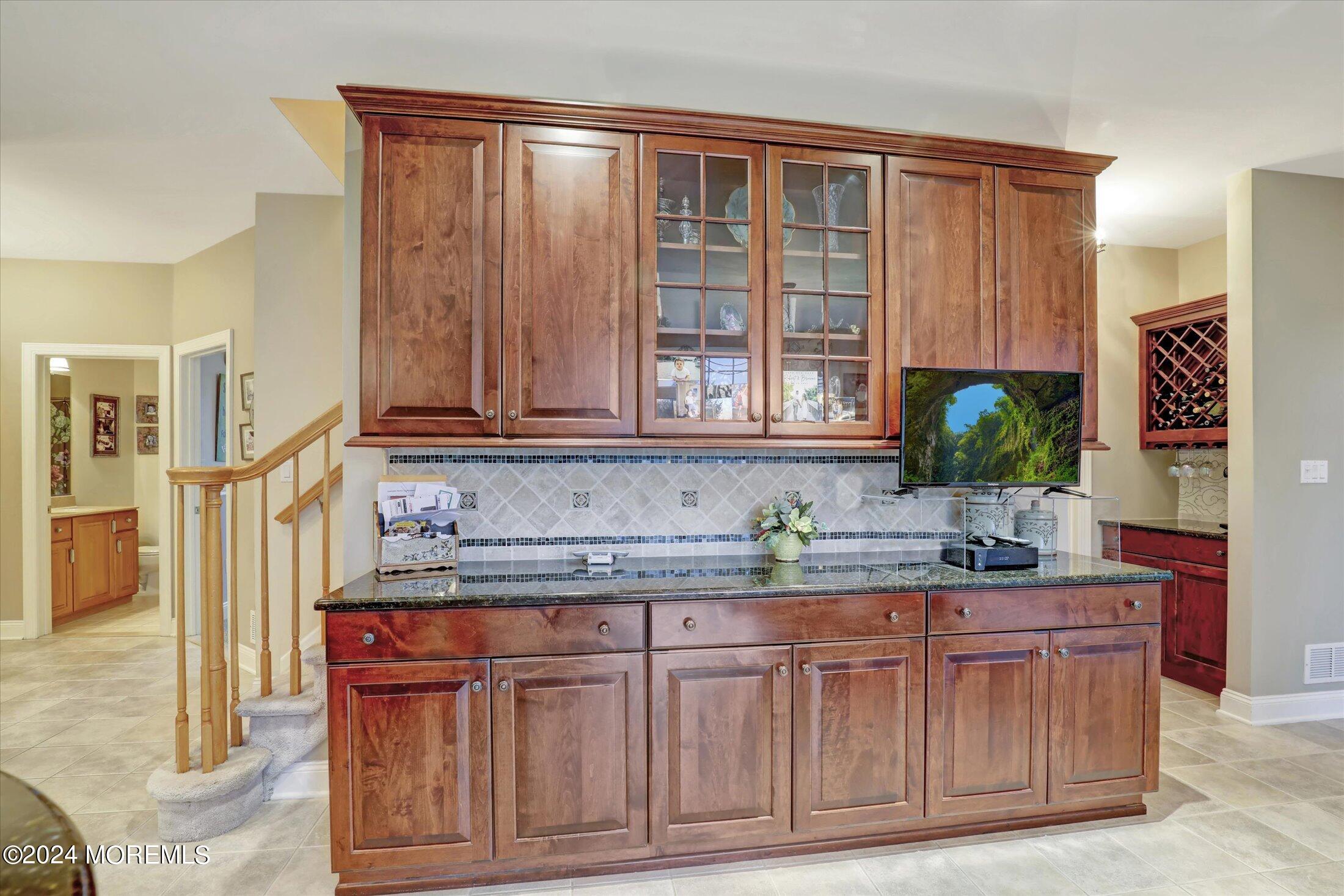 9 Shady Tree Lane Colts Neck, NJ 07722 - Photo 19 of 60 a kitchen with stainless steel appliances granite countertop a sink and a granite counter tops