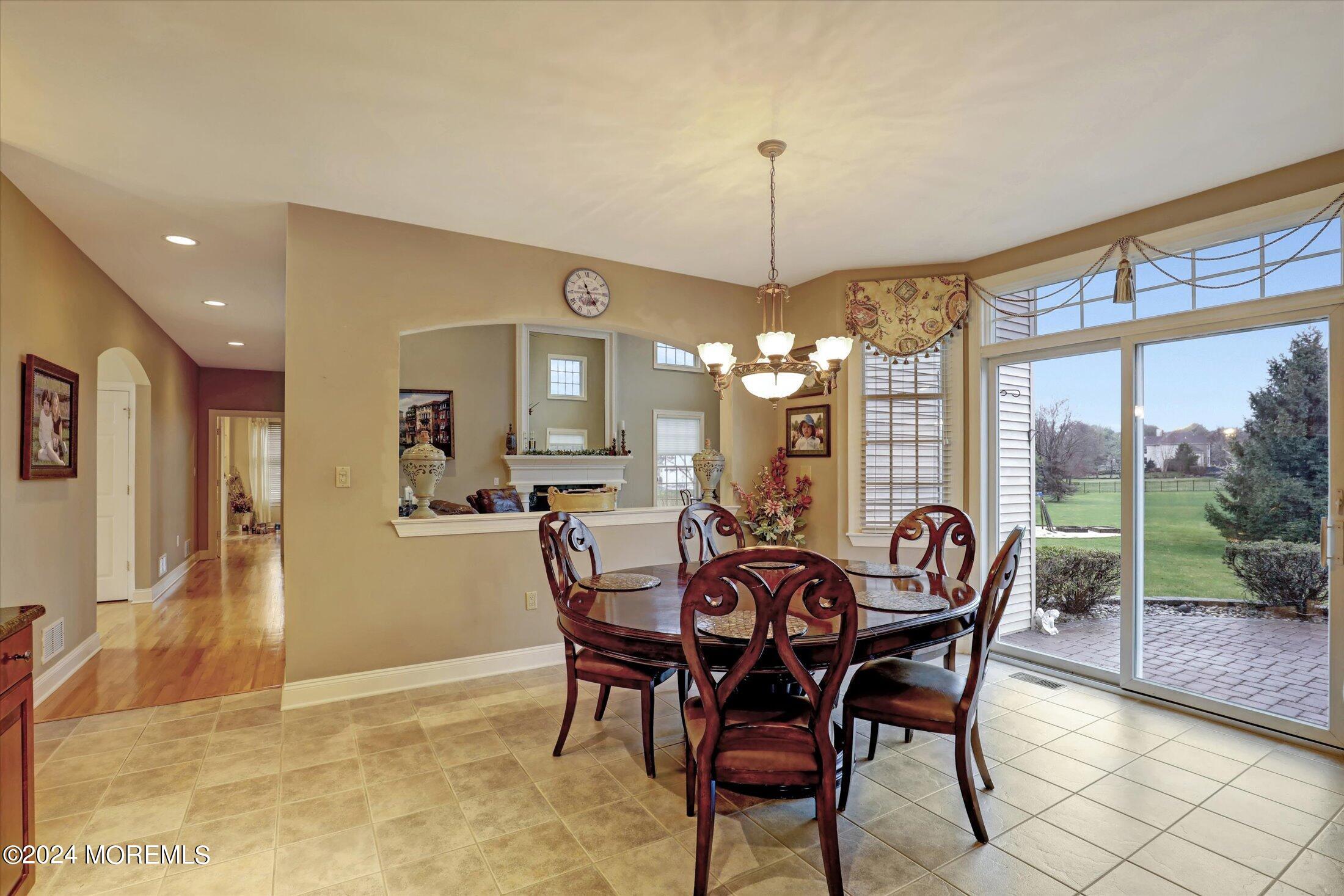 9 Shady Tree Lane Colts Neck, NJ 07722 - Photo 20 of 60 a view of a dining room with furniture window and outside view