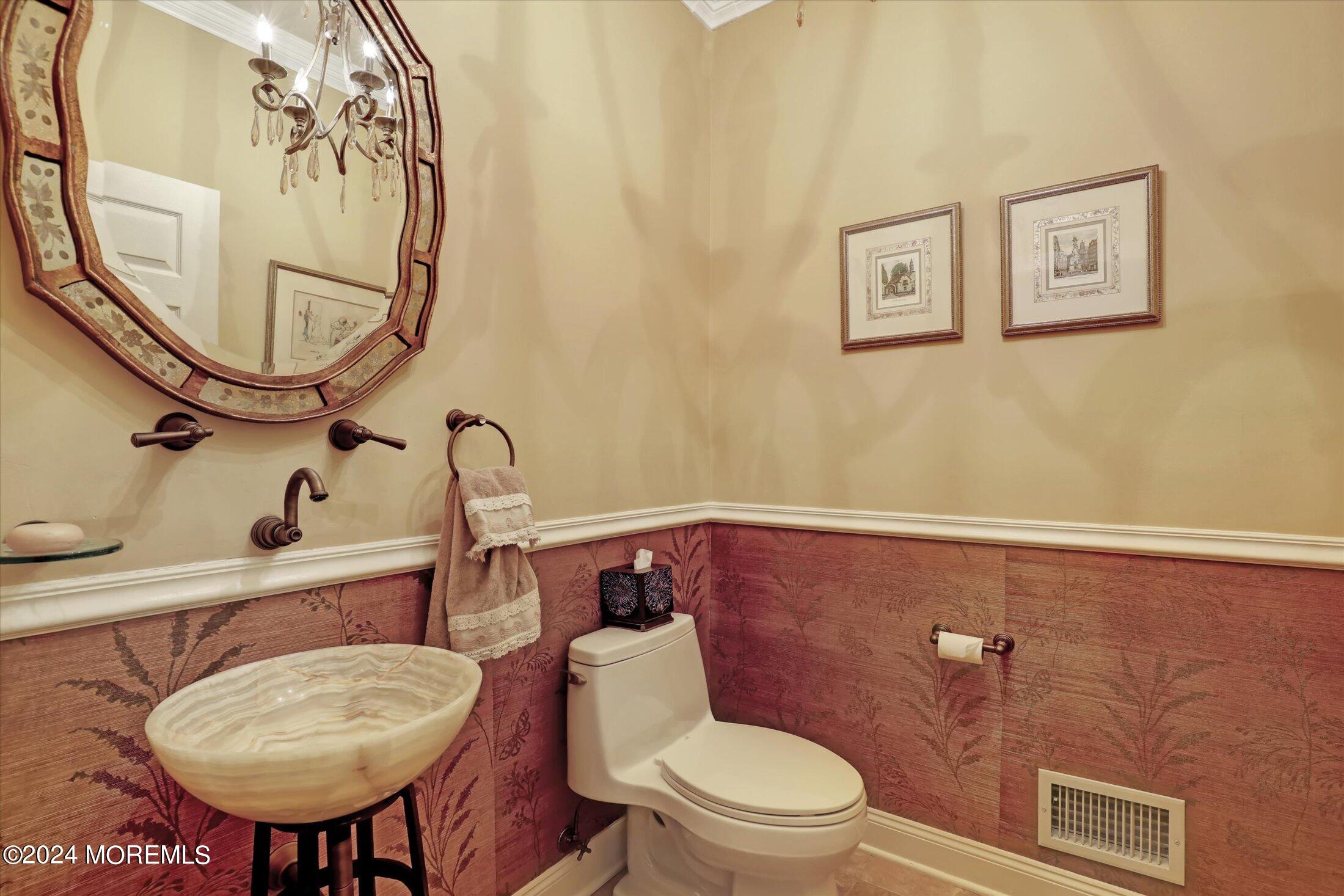 9 Shady Tree Lane Colts Neck, NJ 07722 - Photo 24 of 60 a bathroom with a toilet a sink and a mirror