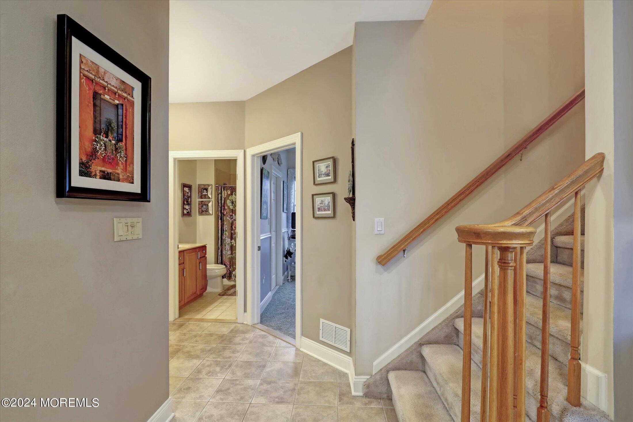 9 Shady Tree Lane Colts Neck, NJ 07722 - Photo 25 of 60 a view of a hallway with windows and entryway