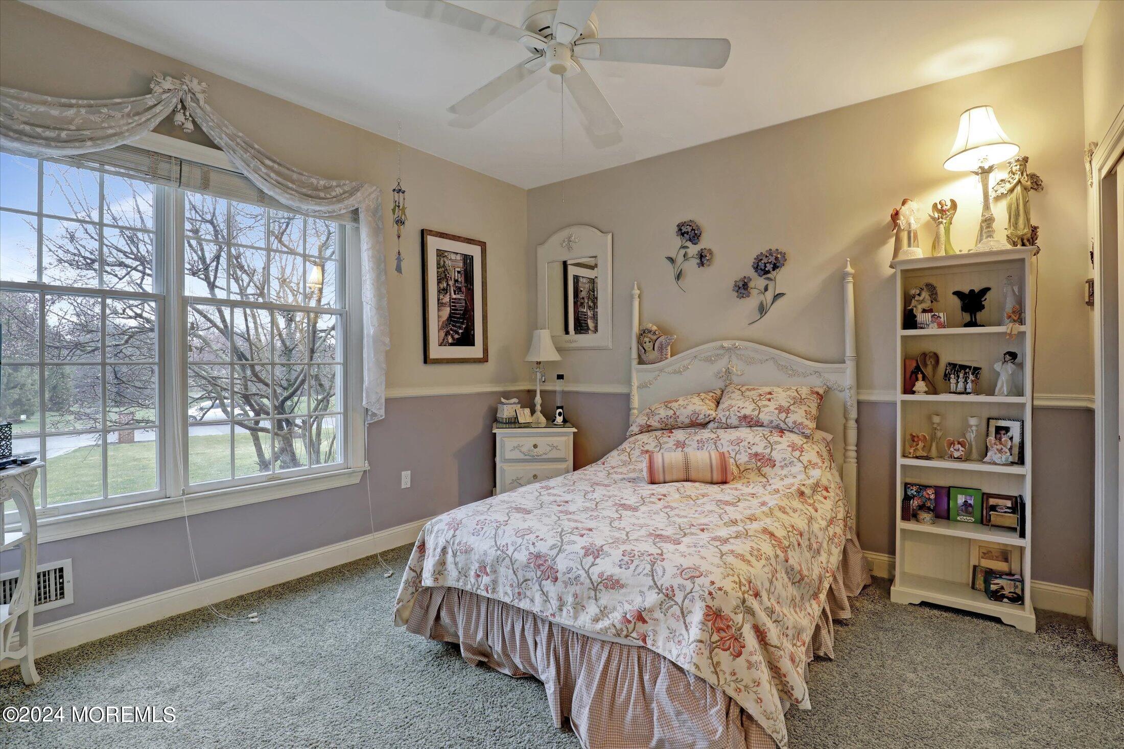 9 Shady Tree Lane Colts Neck, NJ 07722 - Photo 26 of 60 a bedroom with a large bed and a window