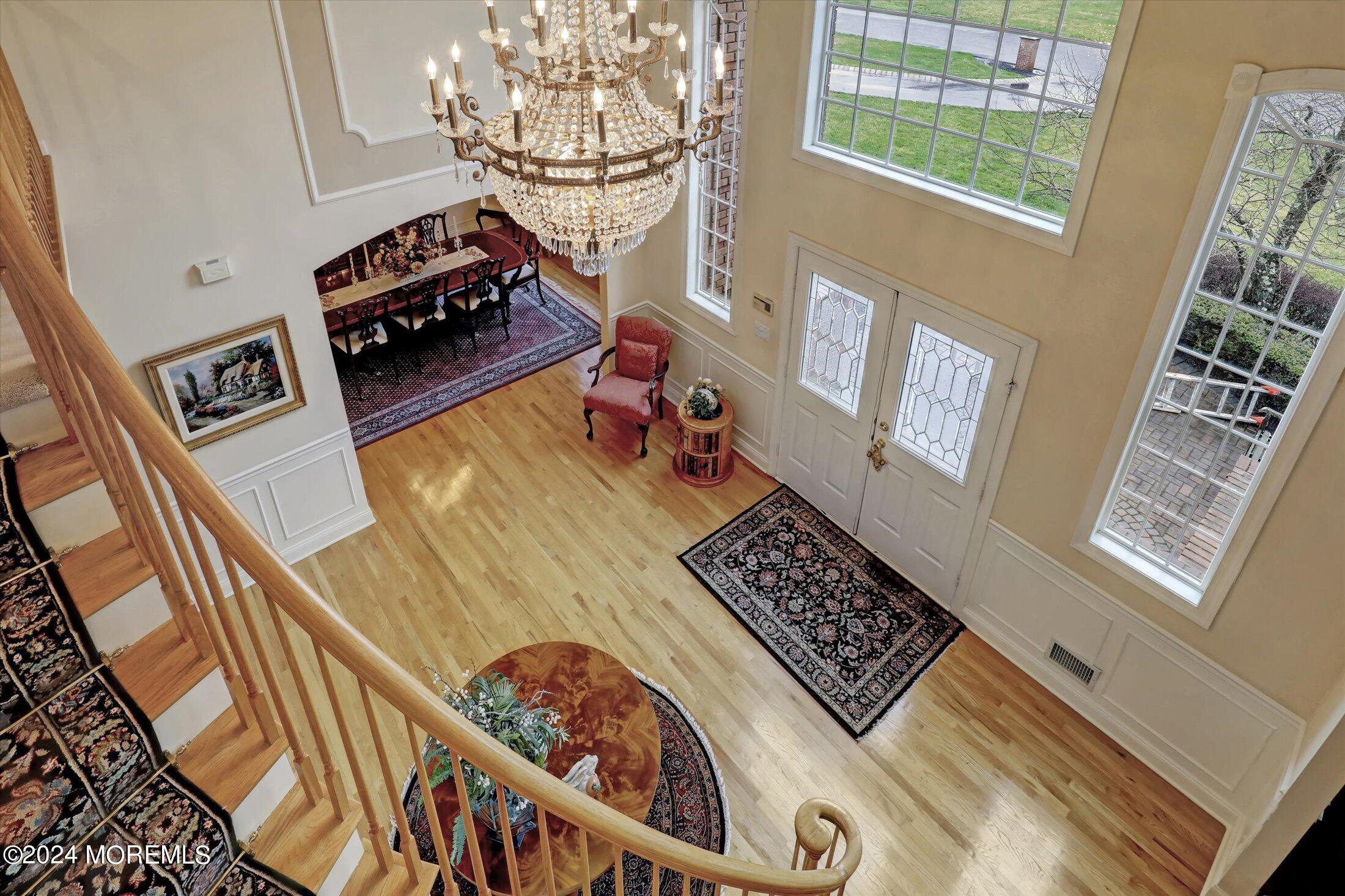 9 Shady Tree Lane Colts Neck, NJ 07722 - Photo 30 of 60 a view of a livingroom with wooden floor and furniture