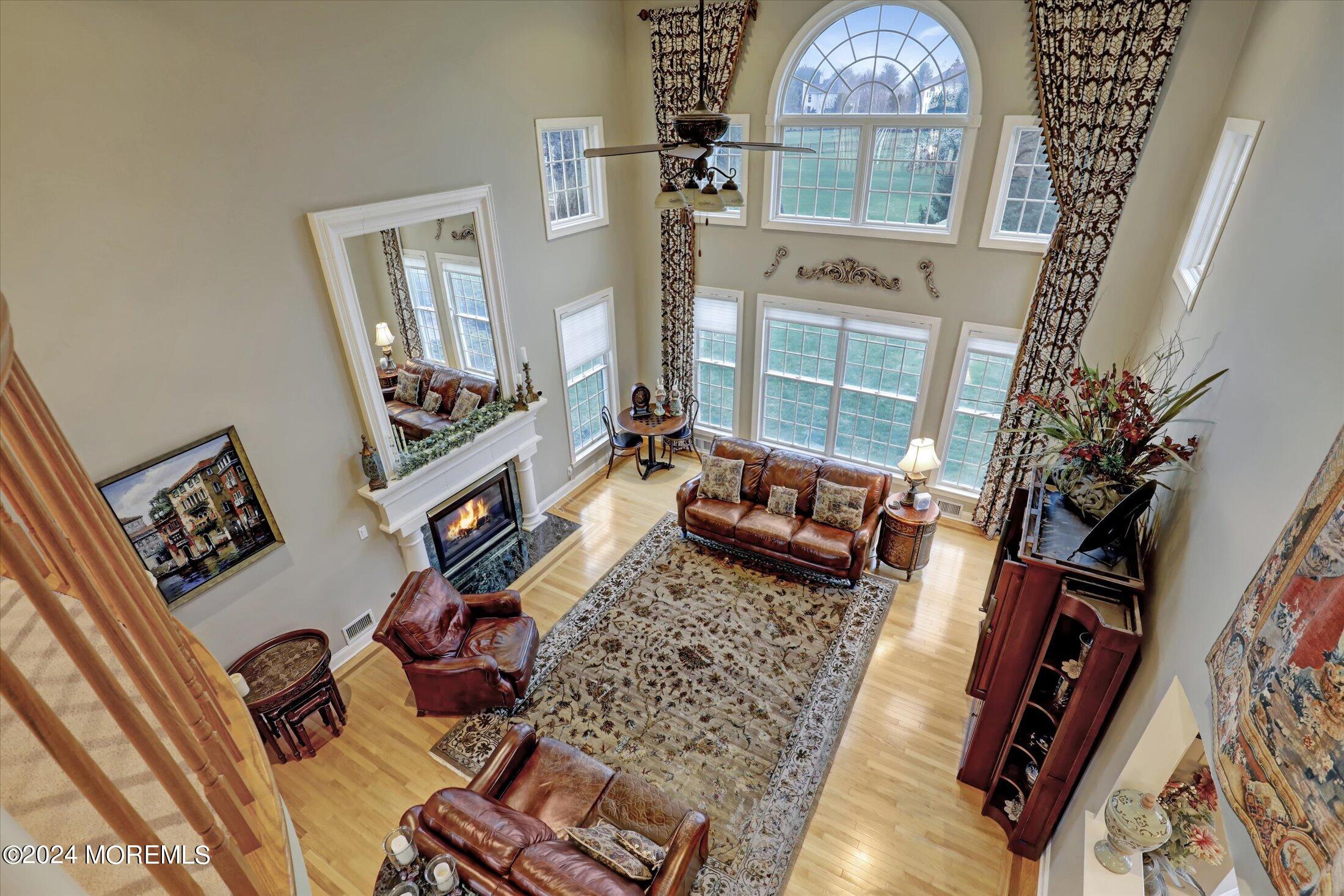 9 Shady Tree Lane Colts Neck, NJ 07722 - Photo 31 of 60 view of living room with furniture and a fireplace
