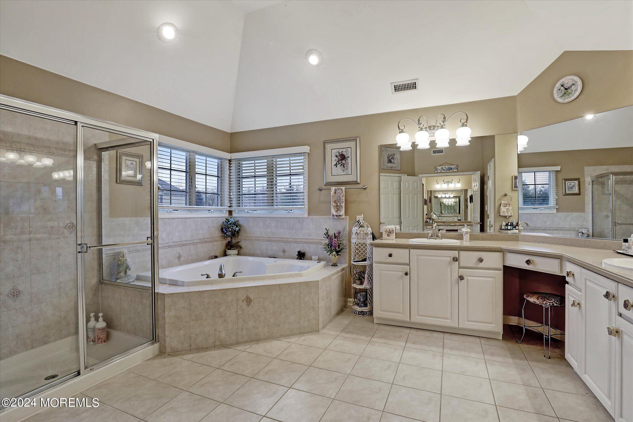 9 Shady Tree Lane Colts Neck, NJ 07722 - Photo 35 of 60 a large spacious bathroom with a large tub shower and sink