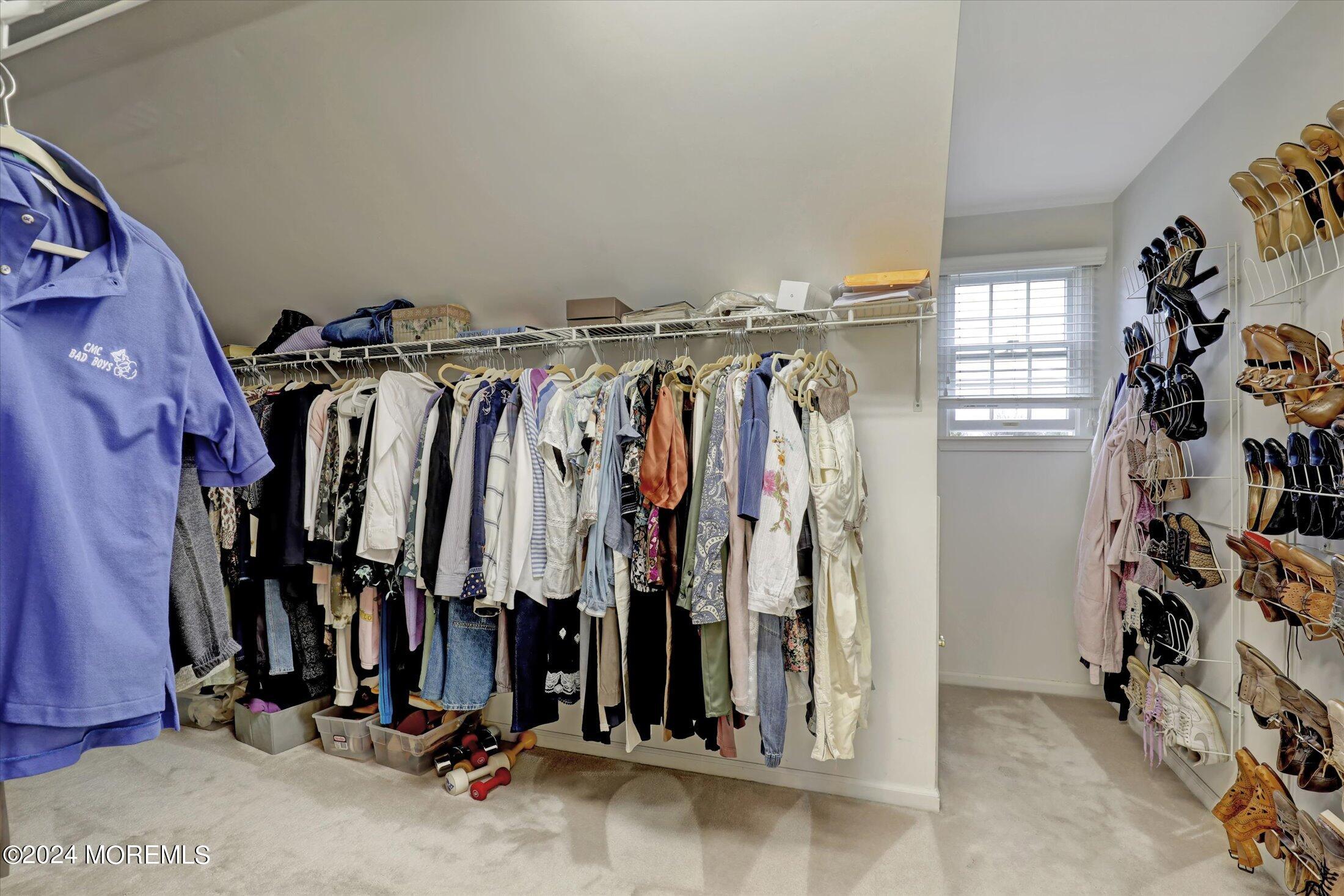 9 Shady Tree Lane Colts Neck, NJ 07722 - Photo 37 of 60 a view of walk in closet with clothes
