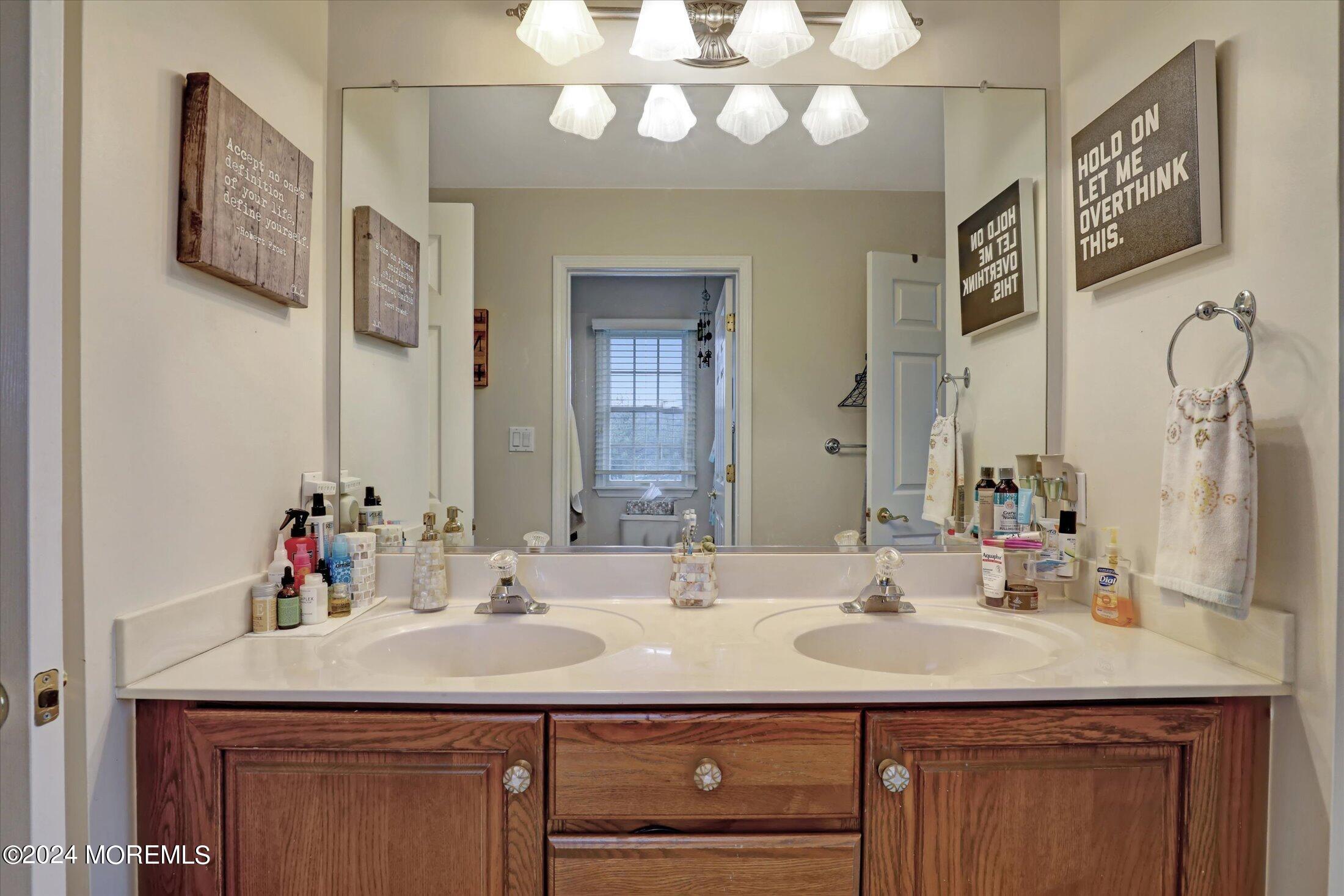 9 Shady Tree Lane Colts Neck, NJ 07722 - Photo 40 of 60 a bathroom with a sink double vanity and a mirror