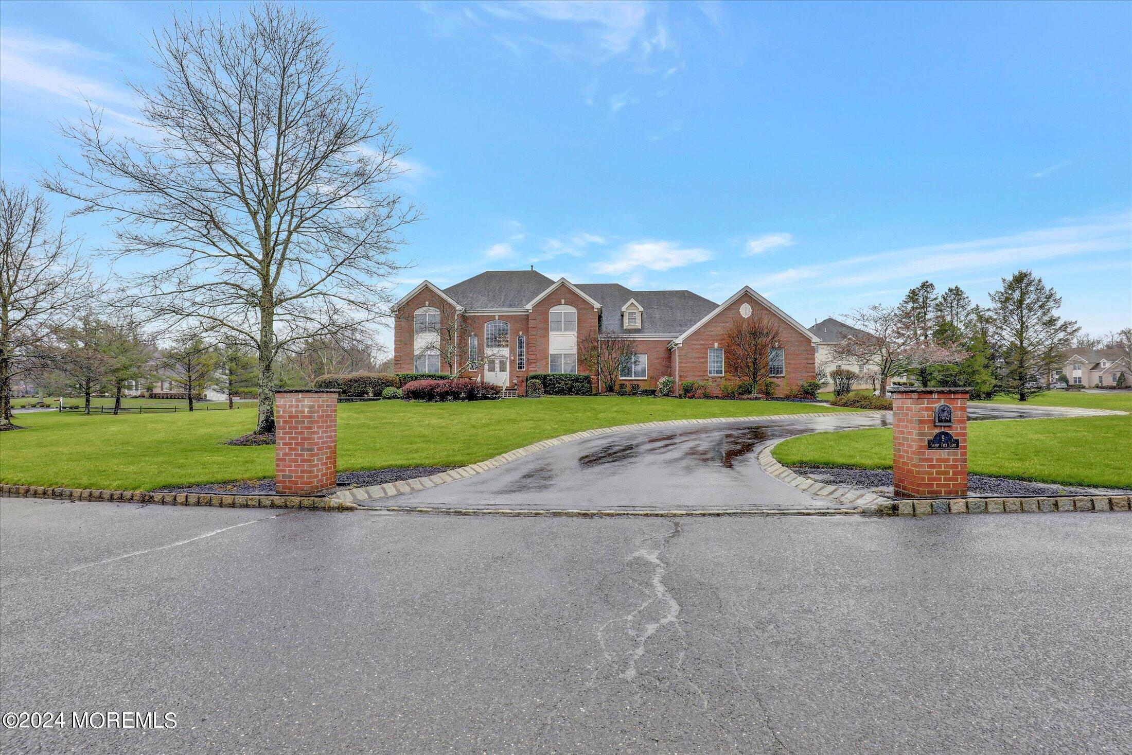9 Shady Tree Lane Colts Neck, NJ 07722 - Photo 4 of 60 a view of yard with swimming pool and green space