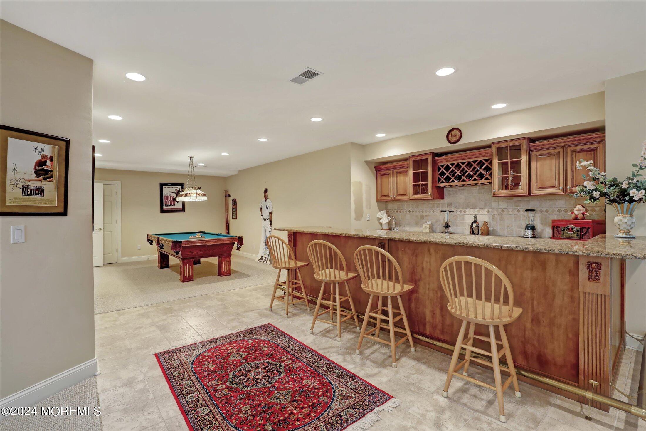 9 Shady Tree Lane Colts Neck, NJ 07722 - Photo 45 of 60 a living room with furniture a rug and white walls