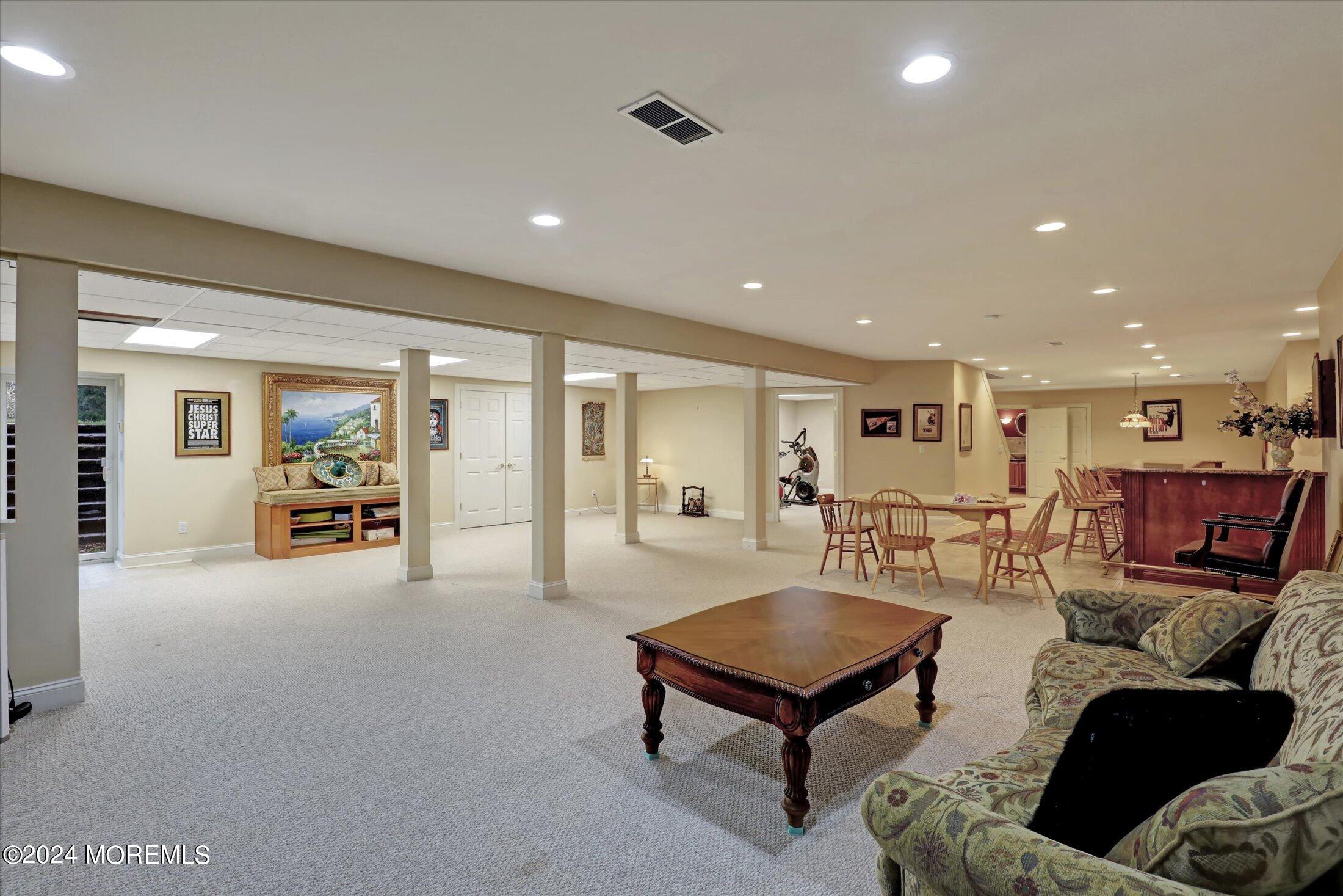 9 Shady Tree Lane Colts Neck, NJ 07722 - Photo 48 of 60 a living room with furniture and a table