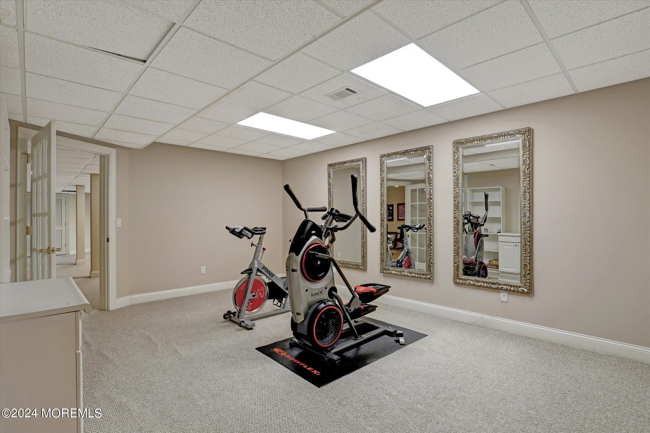 9 Shady Tree Lane Colts Neck, NJ 07722 - Photo 50 of 60 a view of a room with gym equipment