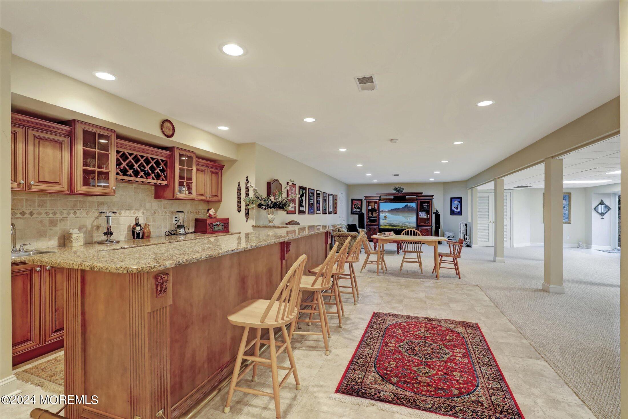 9 Shady Tree Lane Colts Neck, NJ 07722 - Photo 51 of 60 a living room with furniture and view of kitchen