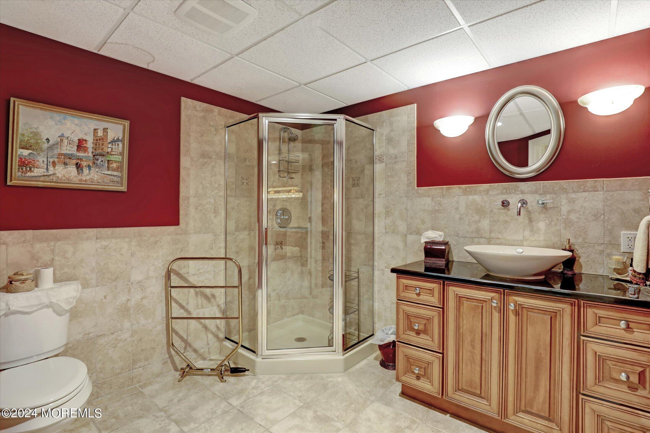 9 Shady Tree Lane Colts Neck, NJ 07722 - Photo 52 of 60 a bathroom with a toilet a sink and a mirror