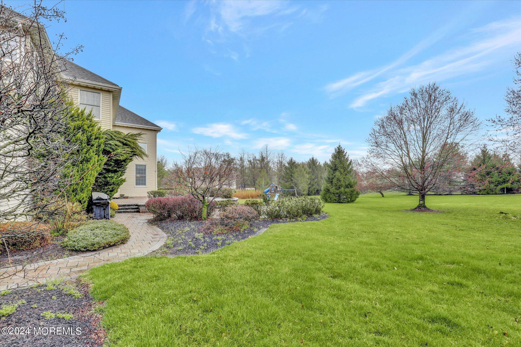 9 Shady Tree Lane Colts Neck, NJ 07722 - Photo 60 of 60 a view of a backyard with plants and trees